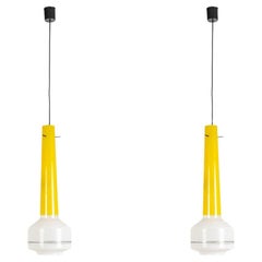 Pair of two-tone yellow and white glass pendant lights. 1960s