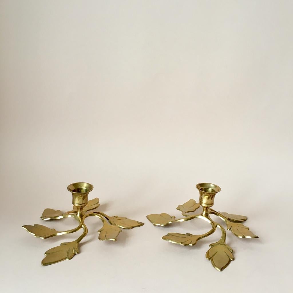 Polished brass leaf shape candleholders.