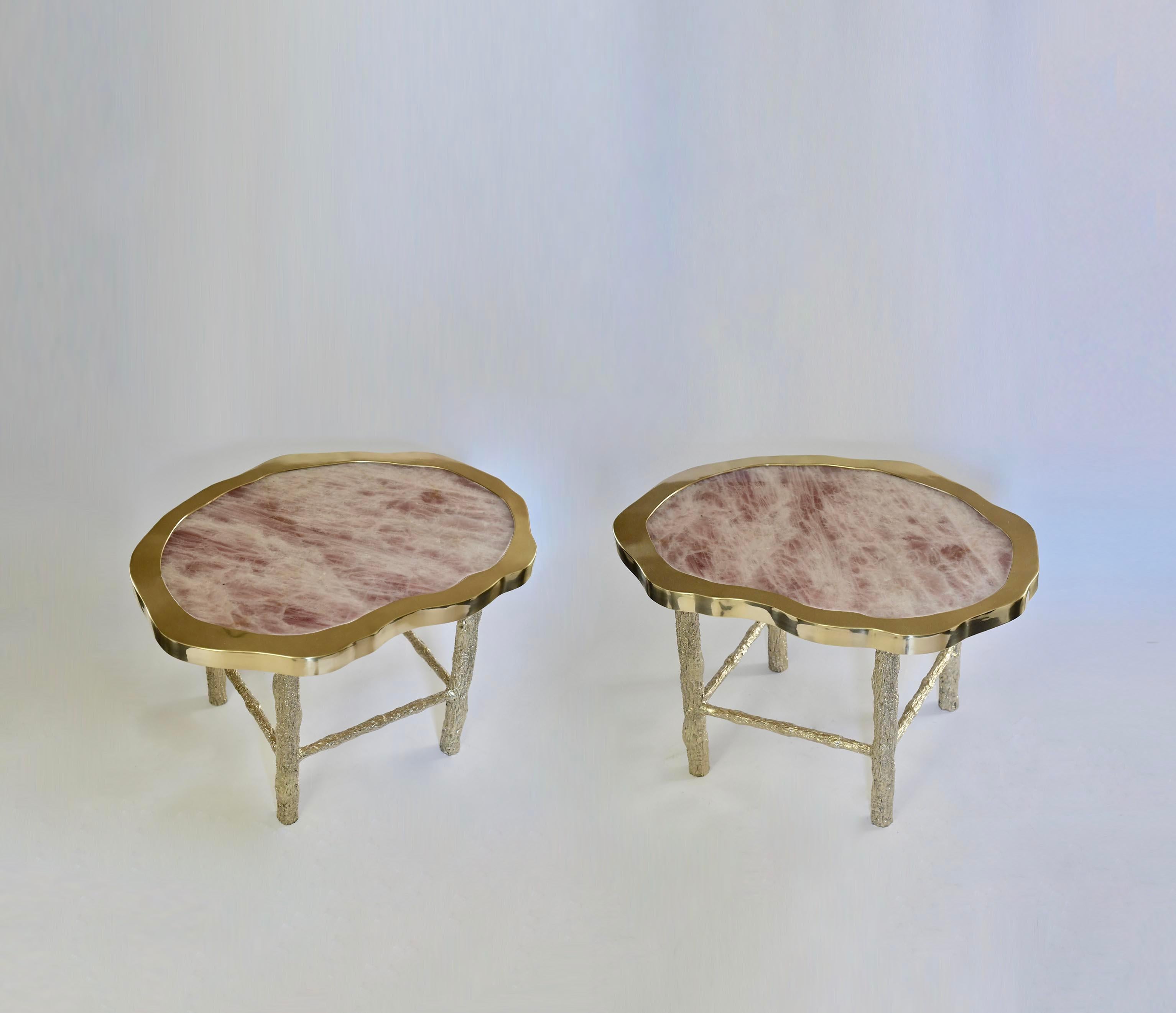 Pair of rose quartz rock crystal cocktail tables with twig inspired hammered brass legs, created by Phoenix Gallery.
Custom size upon request.