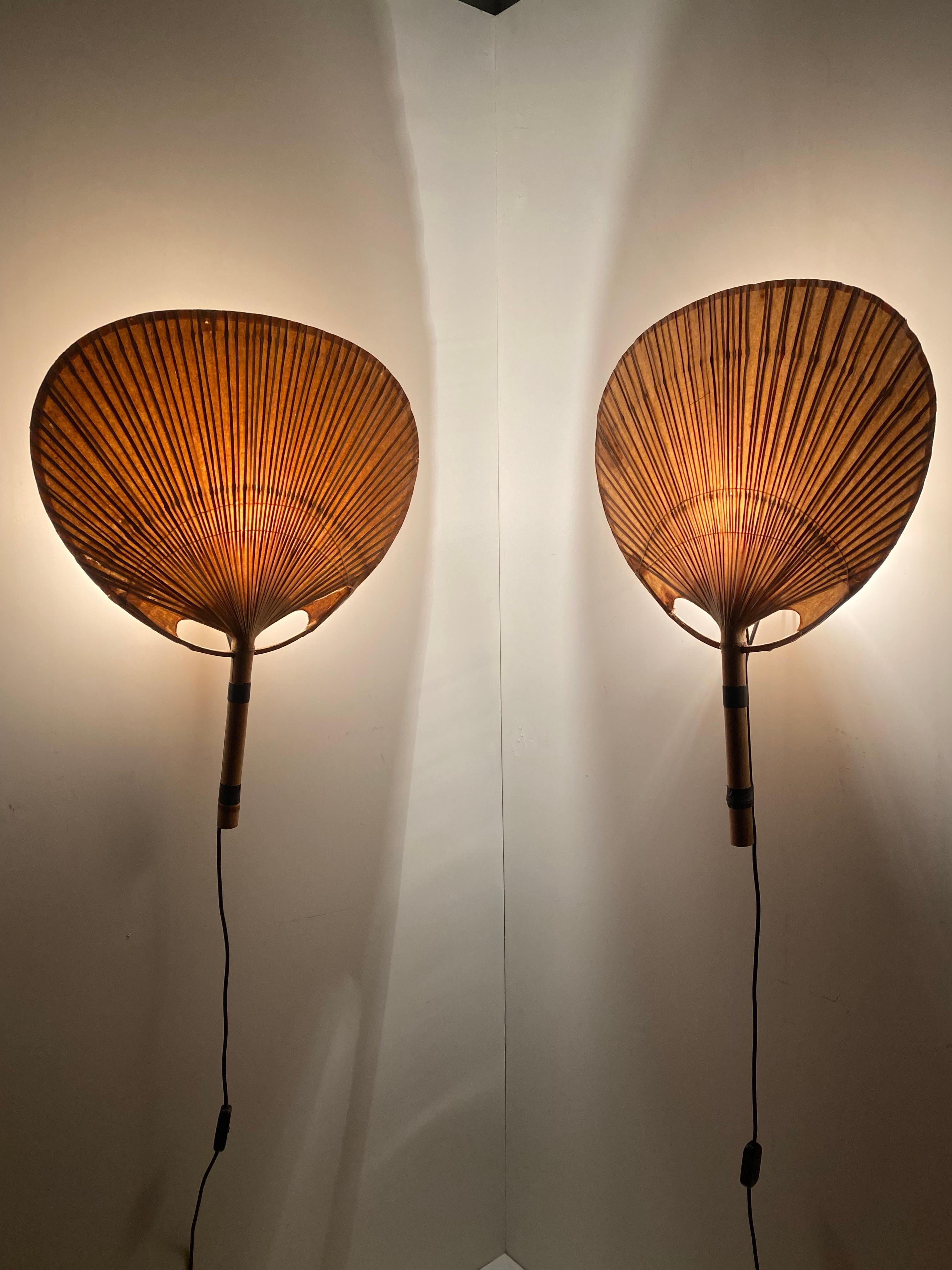 Pair of Uchiwa III wall appliques by Ingo Maurer for M-design Munich Germany 1973

The Uchiwa III is the medium sized version of the Uchiwa series and gives a very impressive diffuse light when lit. 
This stunning light was comprised of bamboo and