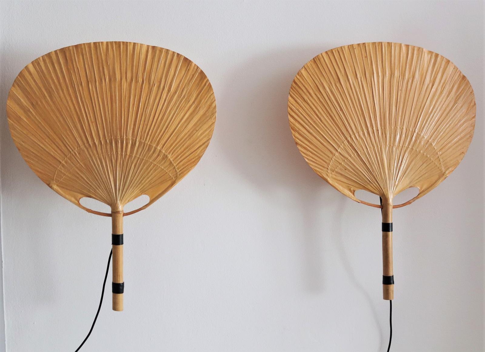 Two pieces of big vintage Uchiwa fan lamps with metal holder for wall hanging.
Designed from Ingo Maurer, Germany in 1973.
All fans are handmade of bamboo and Japanese rice paper.
The metal holders are equipped with original Edison bulb holders