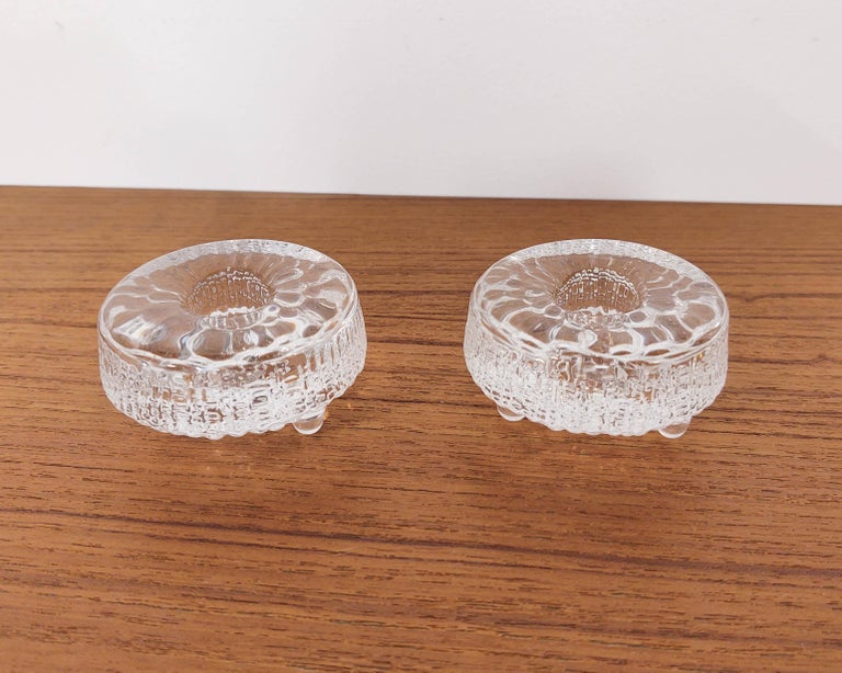 Pair of textured glass candle holders from the Ultima Thule collection designed by Tapio Wirkkala for iittala, Finland. Excellent condition.

Measures: 3” W x 1.5” H.