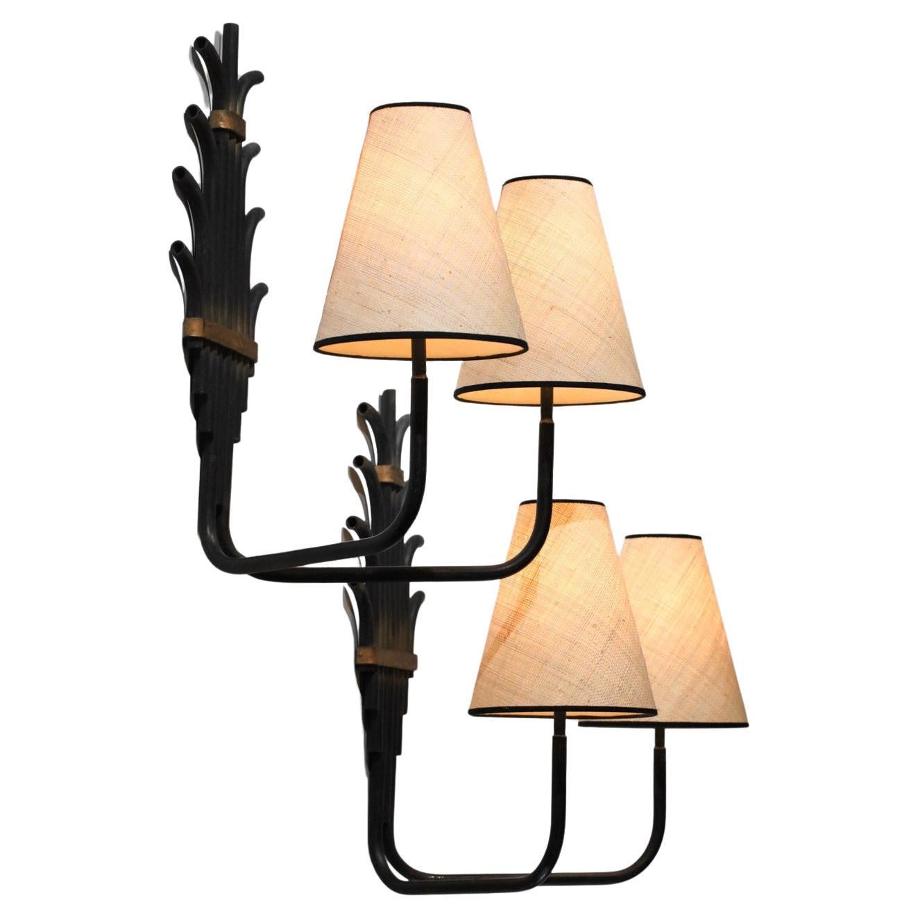 Pair of unidentified tube sconces in the style of Jean Royère from the 1950s. Structure in patinated and gilded lacquered metal. Custom-made lampshade. Very decorative and original sconces. Beautiful vintage condition, with traces of age and use