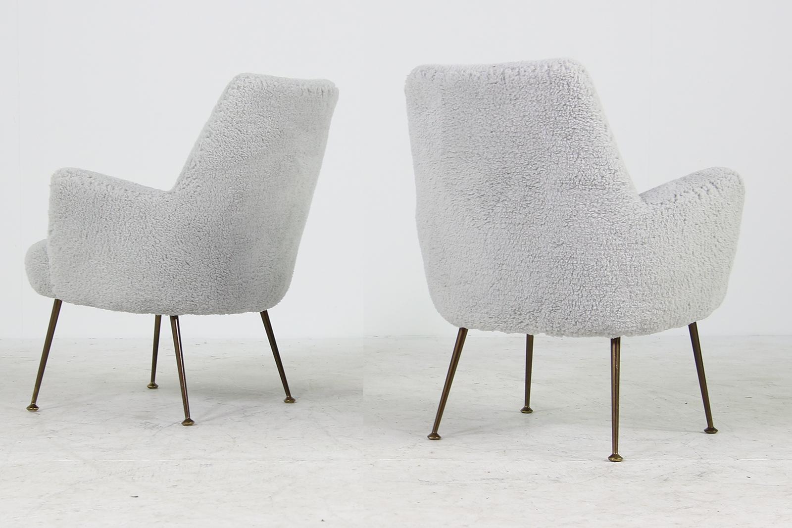 Beautiful and very rare 1950s pair of organic lounge chairs, Italy circa 1950 with new upholstery and covered with new super soft light grey teddy fur fabric, like sheepskin, but cotton mix fabric, very soft to the touch, legs are made of brass.