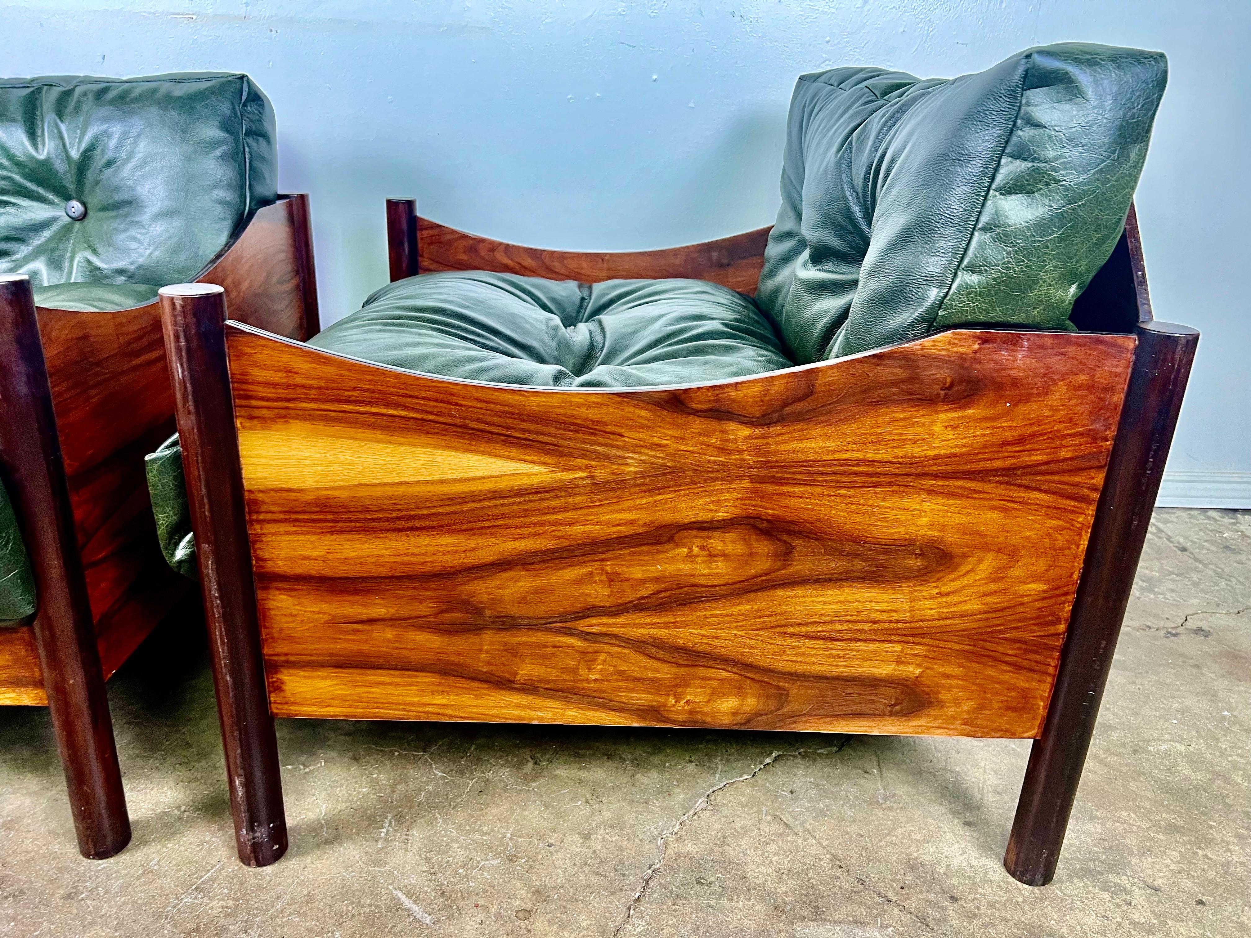 These Brazilian exotic rosewood armchairs from Industria Brasileira are a unique and exquisite find, especially with the custom made details and association with the 1960s designer furniture scene in Sao Paulo.  The green leather cushions add a