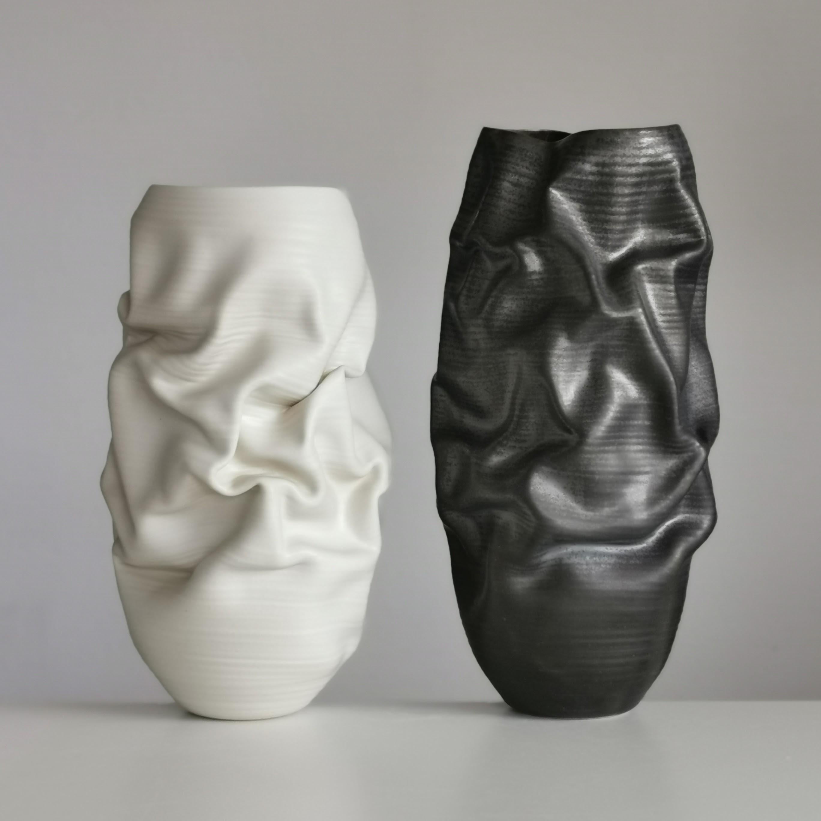New ceramic vessels from ceramic artist Nicholas Arroyave-Portela. 'Water Spirits' pieces (n.65 and n.64) are sold as a pair.

No. 65 tall white crumpled form (Vessel, Interior sculpture, not suitable for holding water)
White St.Thomas clay,