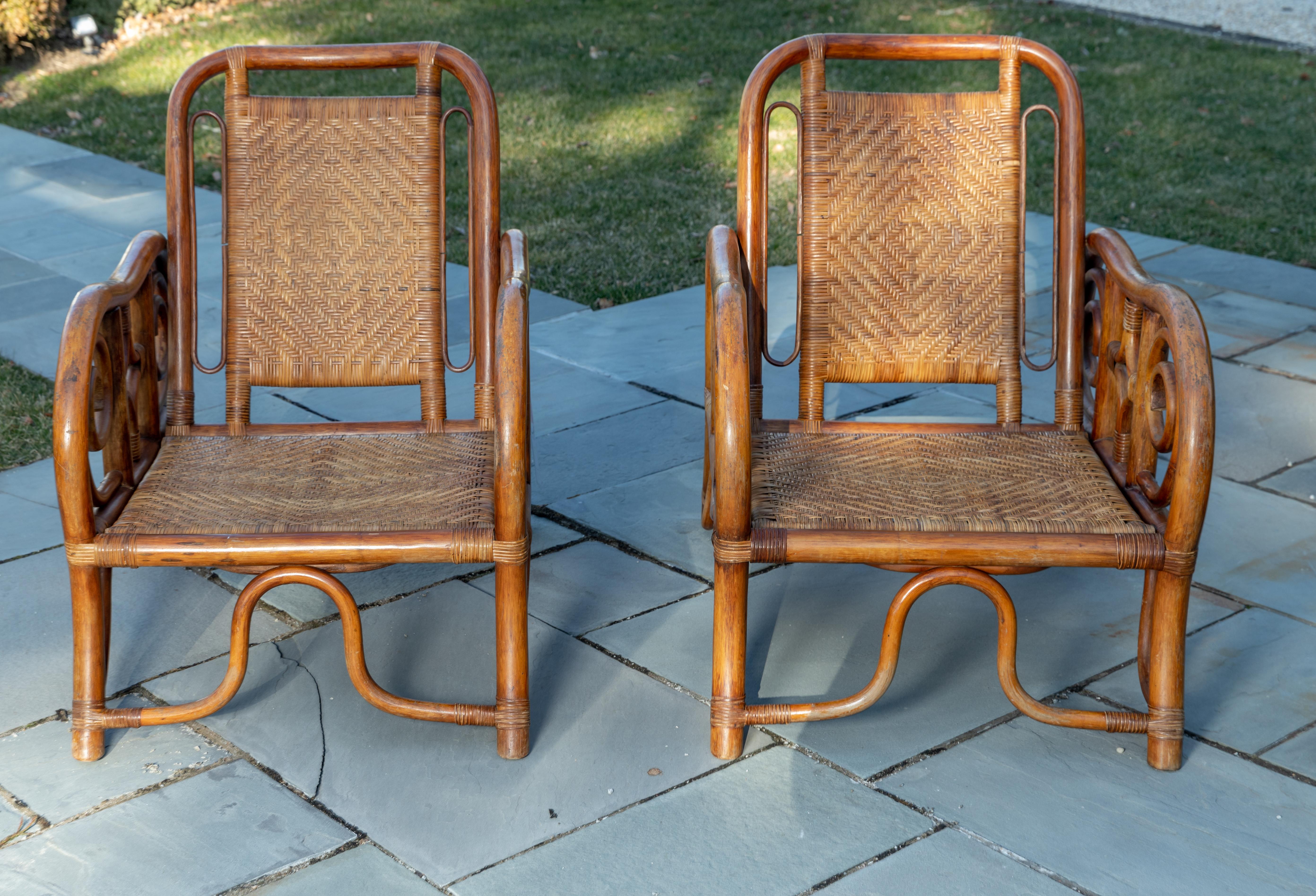 Pair of unique rattan woven armchairs.
