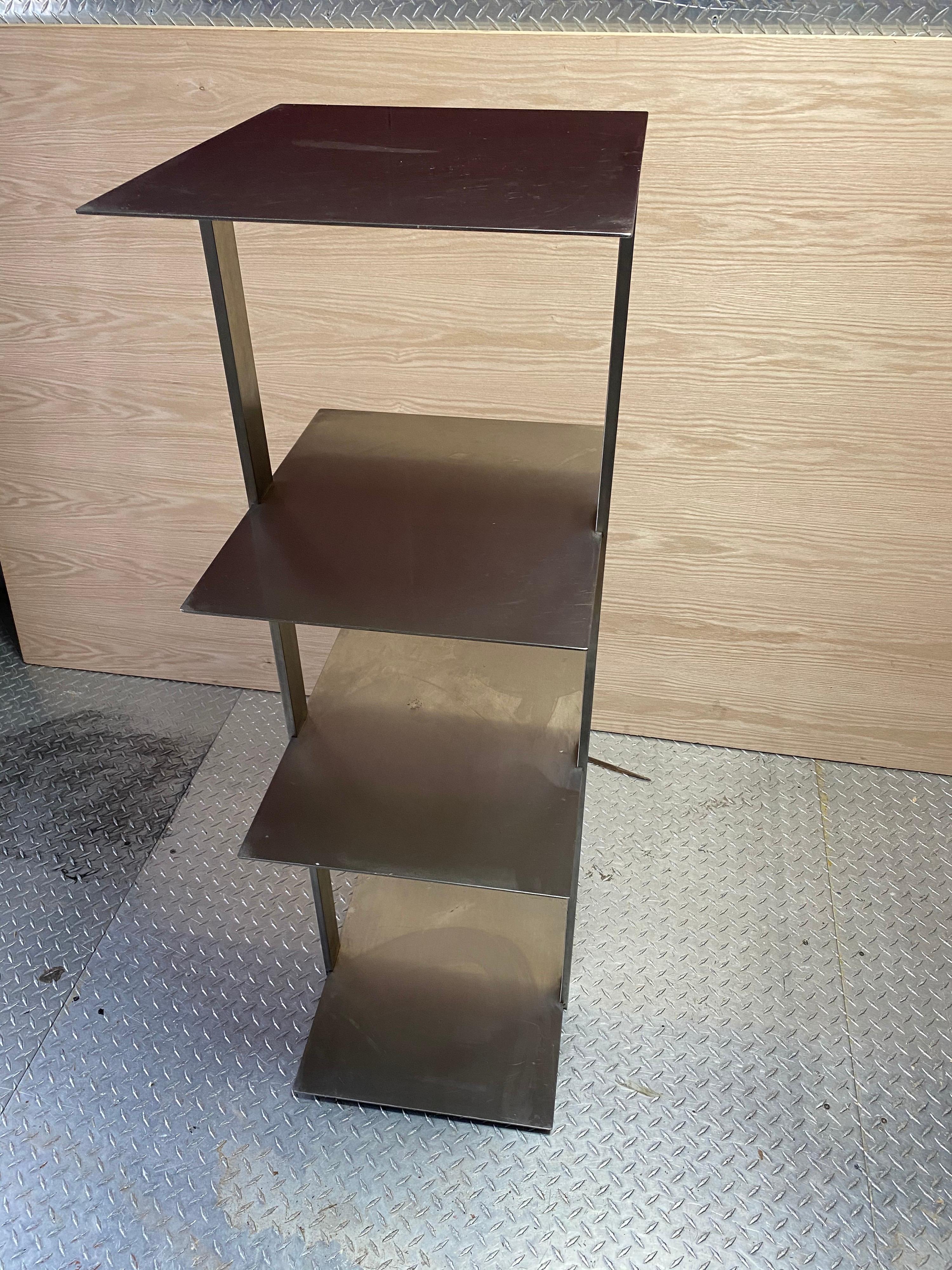 Mid-20th century design Brushed stainless steel and solid 4 shelves. Great lines and solid construction. Measures: height between shelves 13.75