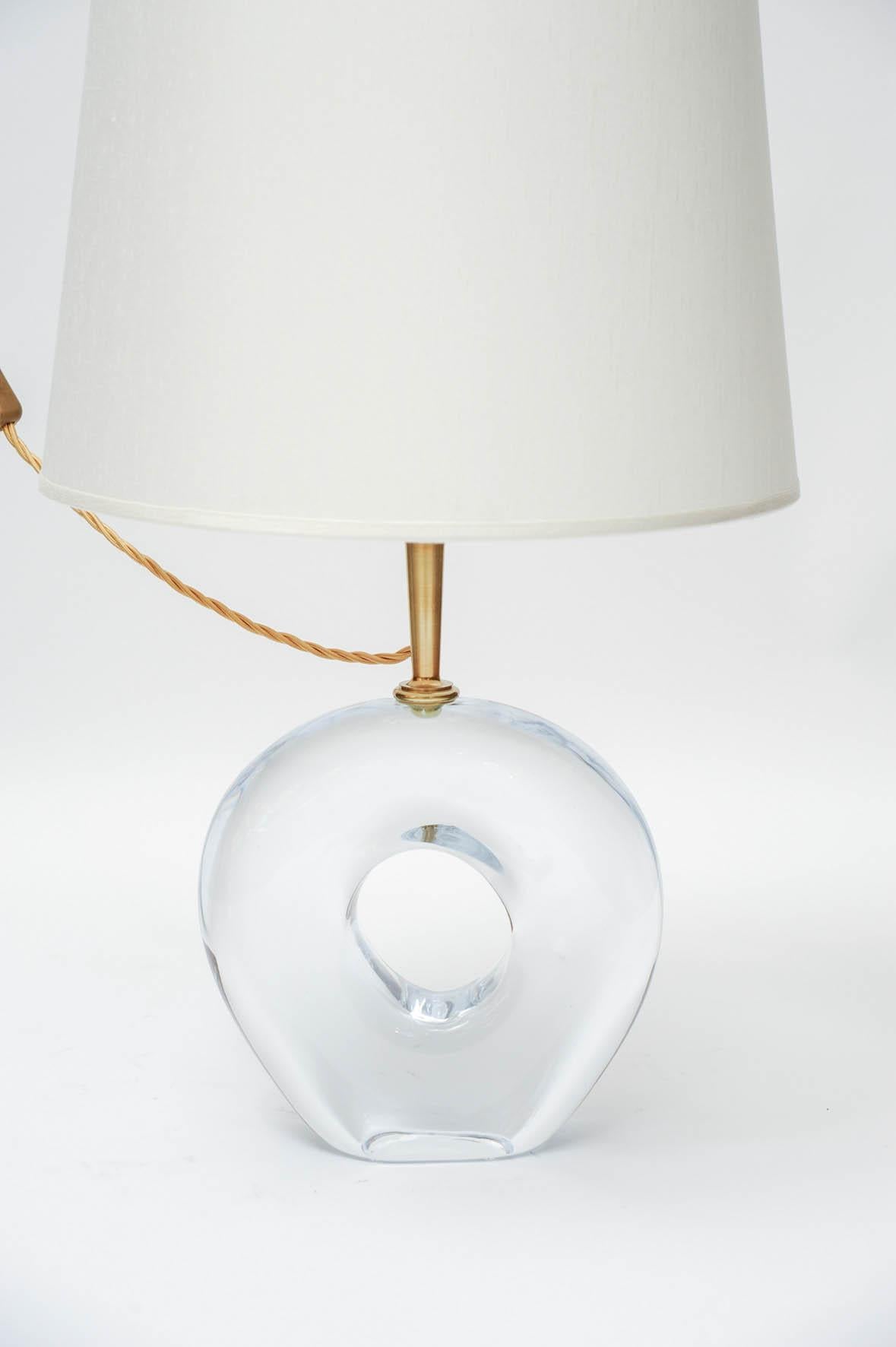 Unique pair of table lamps called Aura by the famous edition house Esperia, made for Glustin Luminaires.

Massive and thick Murano glass piece topped with a brass neck holding the light socket.