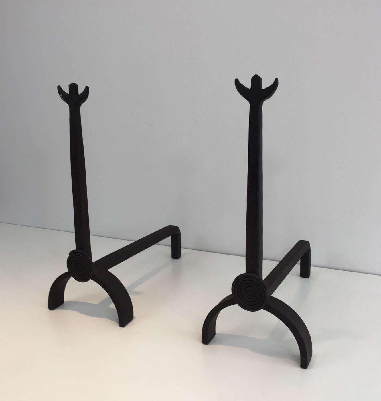 This pair of wrought iron andirons are French, from the 1970s. They are in the style of Garouste et Bonetti.