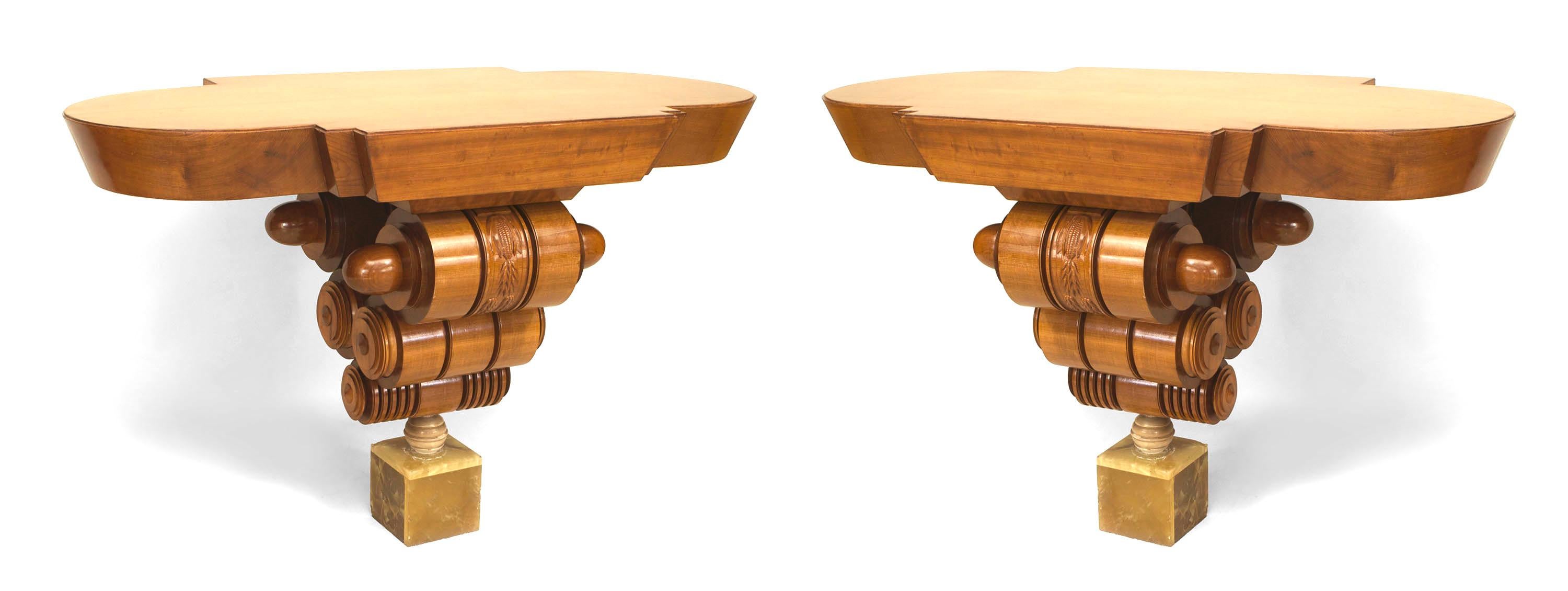 Pair of Art Deco (Possibly American) maple console tables with 1/2 round side rectangular tops over 5 graduated turned & carved cylinders above a green onyx base. (priced as pair).
 