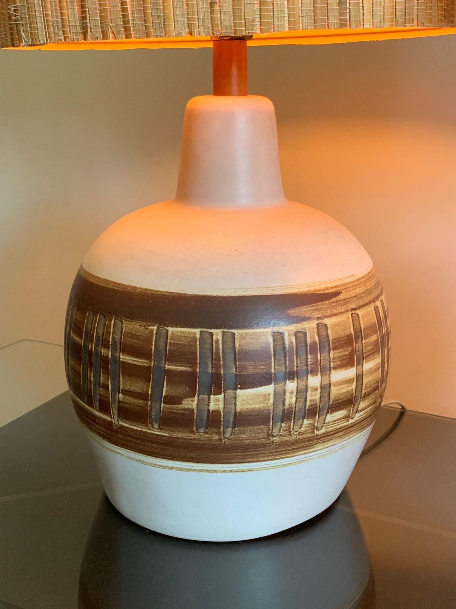 A pair of unusual ceramic lamps by Gordon Martz for Marshall studios decorated with vertical lines.