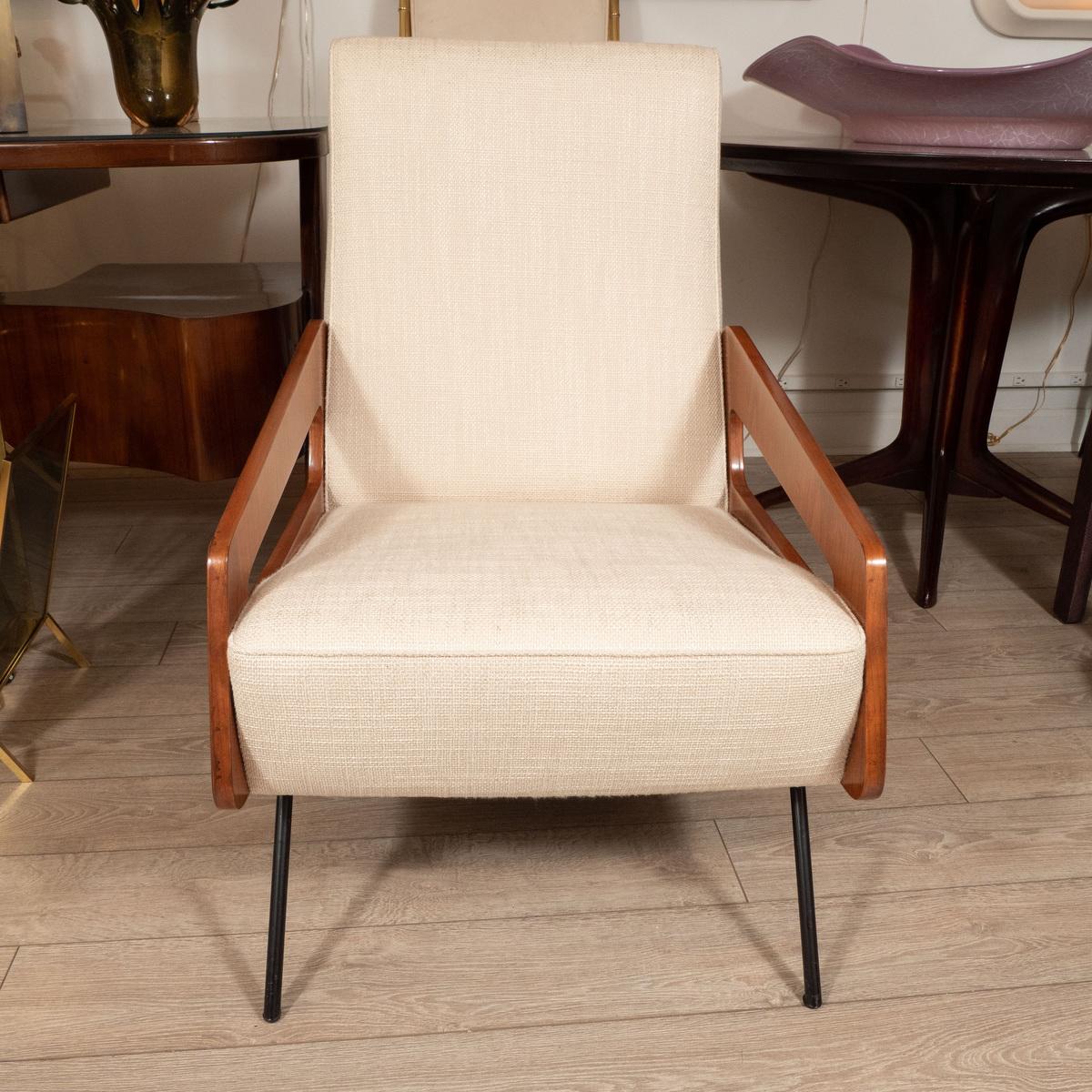 Pair of unusual cherrywood armchairs with stylized cutout frame.