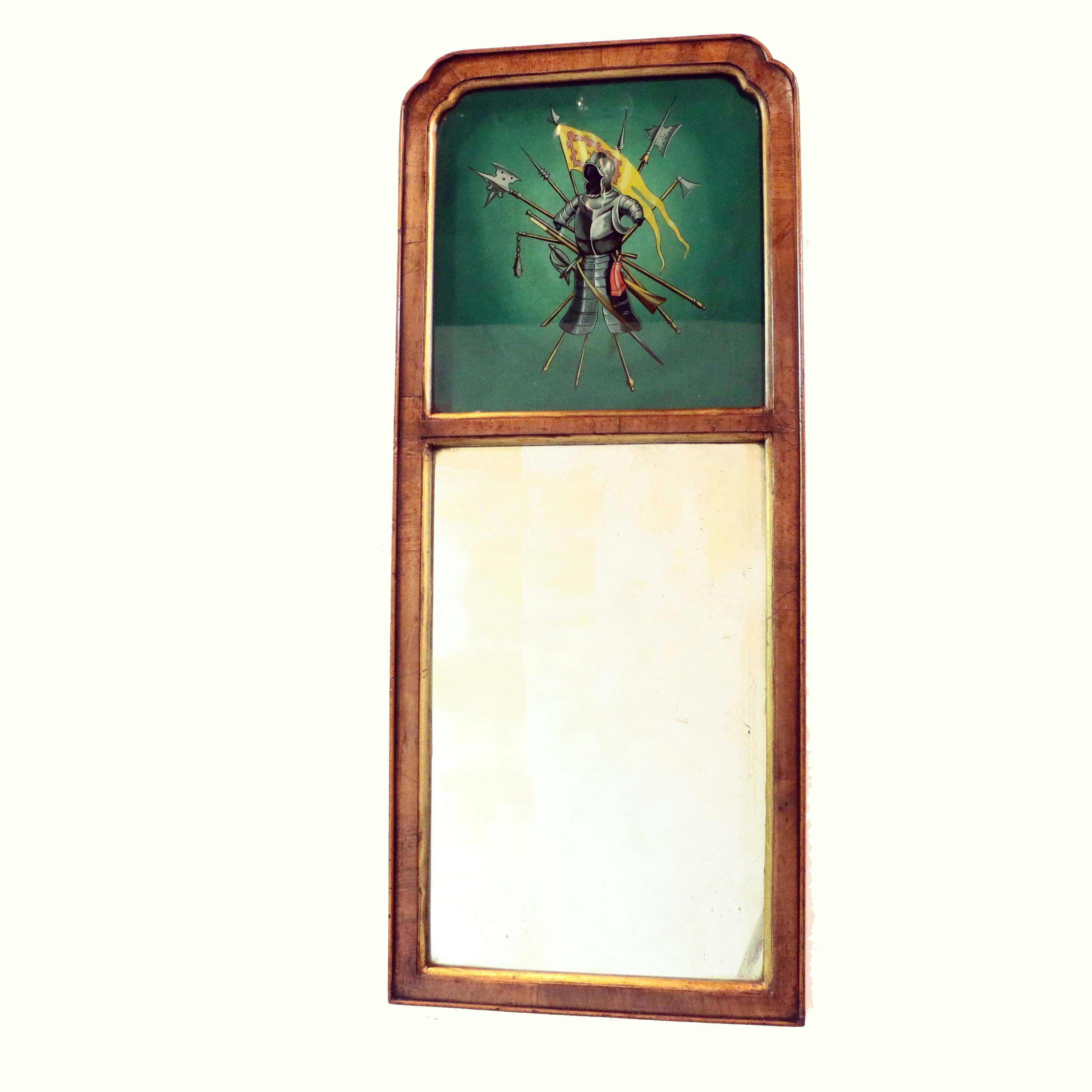 This parcel gilt and walnut veneered pair seem rather English in feel although this type of mirror is typically French. Also these most unusual martial trophies are something we have not seen before. They are reverse painted on a shaded green ground