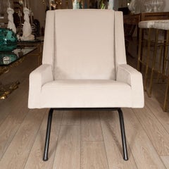 Pair of unusual wood sided upholstered chairs