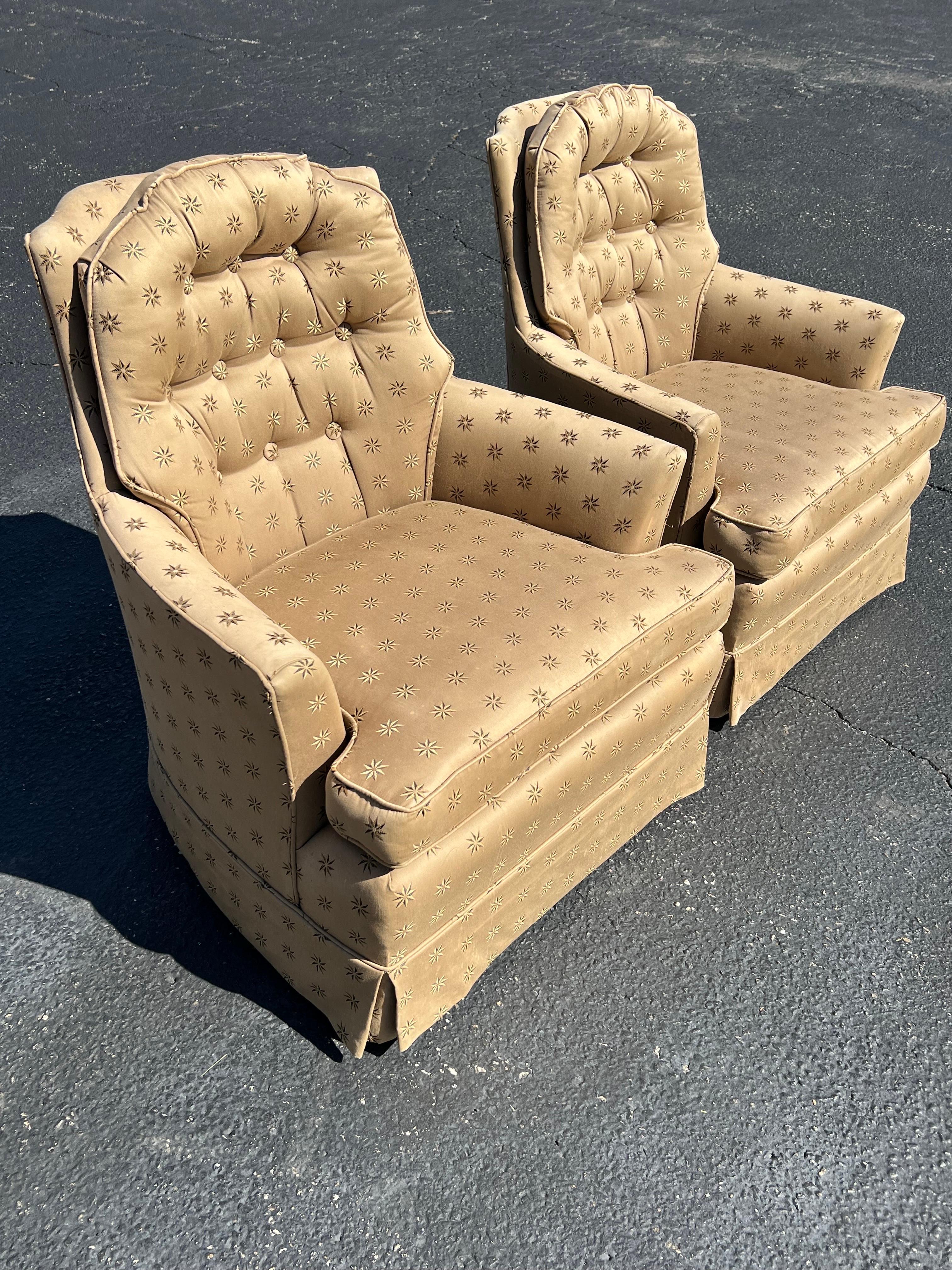 Pair of Upholstered Arm Chairs. These classic styled chairs are covered in a silk upholstery with embroidered stars. Super comfortable and attractive. Solid construction.Although the fabric is amazing it might be best to recover as there is some