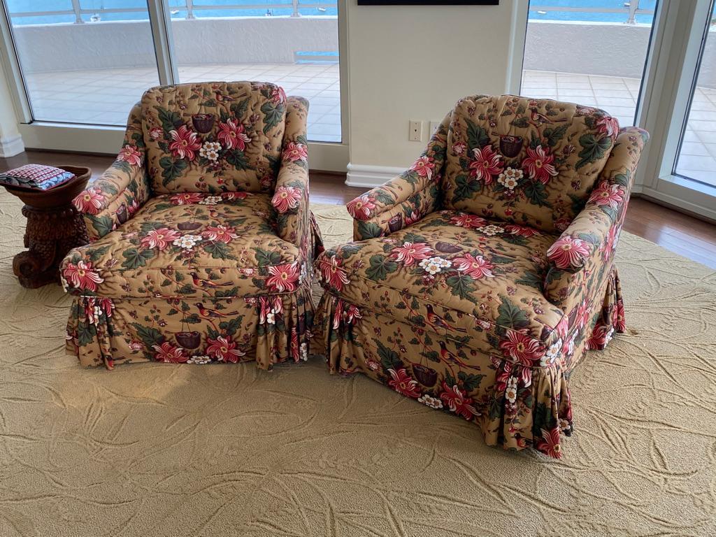 This pair of armchairs are comfortable upholstered in Schumacher Chintz with a quitting design around flowers and leaves.