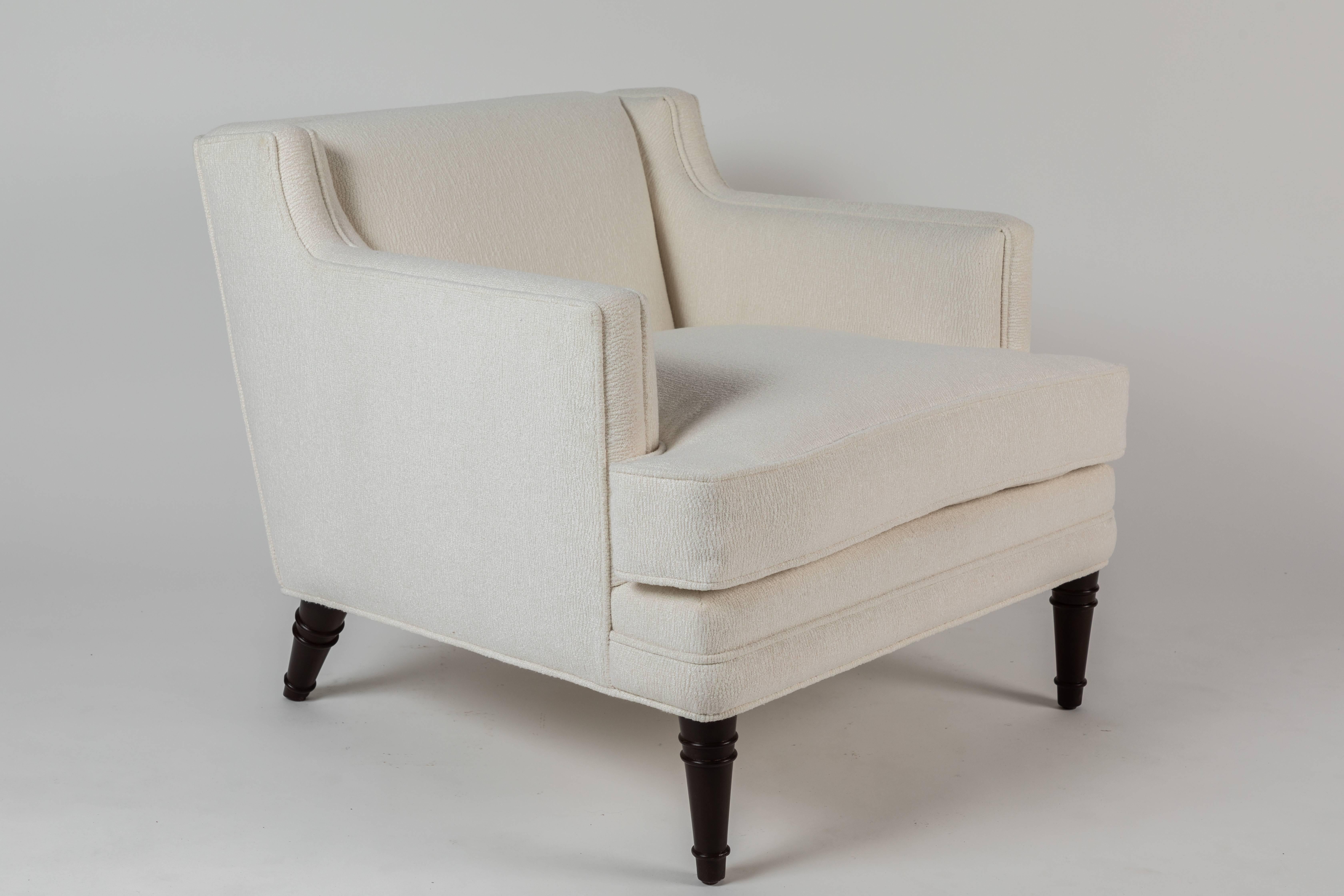 This pair of Seniah chair designed by William Haines features a stylized “bamboo” leg consisting of a ringed conical form on the front and back of the chair. A loose cushion seat add to the overall comfort. The sofa version of this same model was
