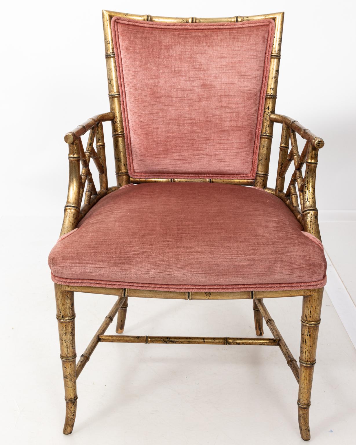 Pair of square back upholstered armchairs with gilt painted faux bamboo frame, circa 1960s. Please note of wear consistent with age including minor finish loss and chips.