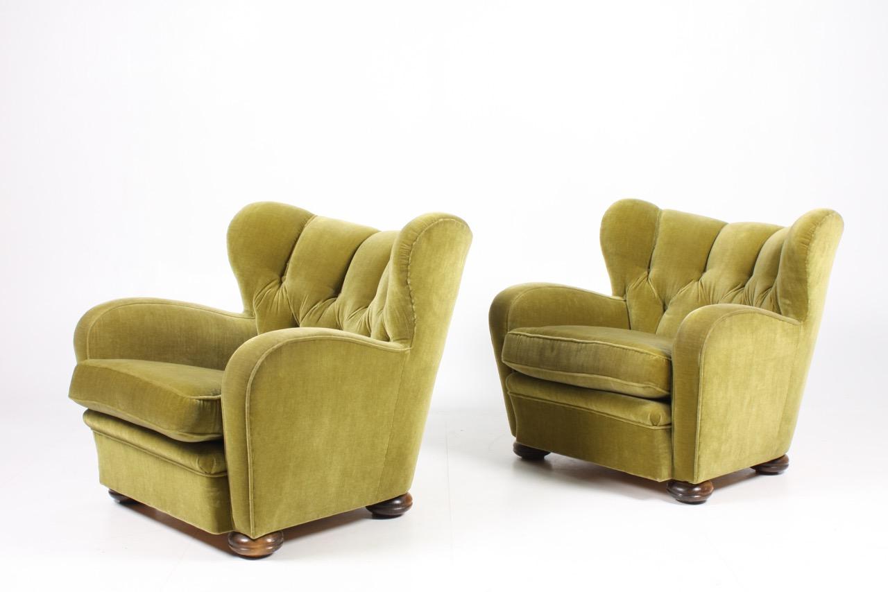 Pair of lounge chairs upholstered in velour, designed and made in Denmark in the 1940s. Great original condition.