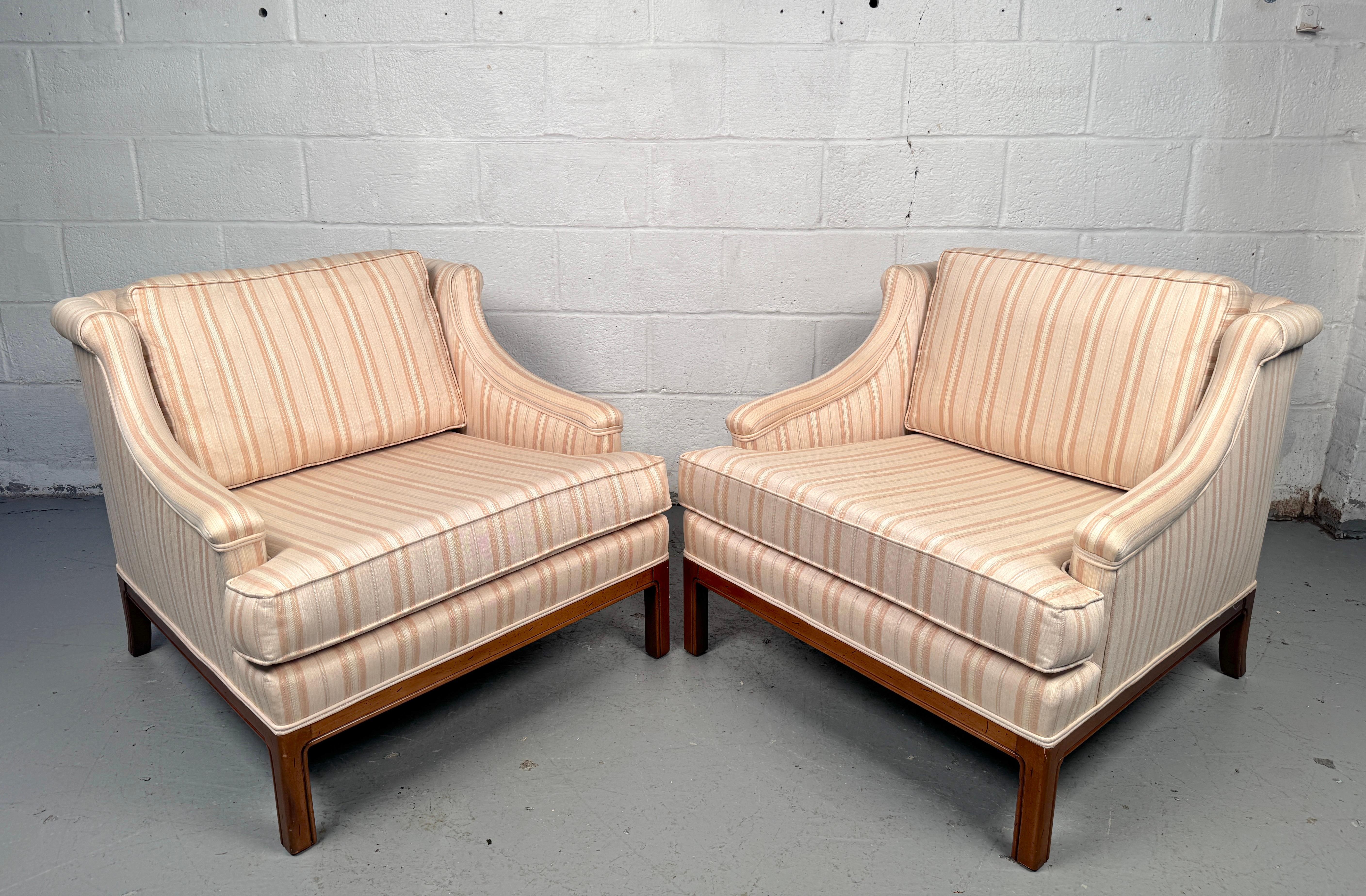A pair of comfortable and stylish mid-century lounge chairs. Features a teak structure and thick cushioning. This pair would complement any living room with a distinct mid-century palate. 

Please confirm item location with seller (NY or NJ).