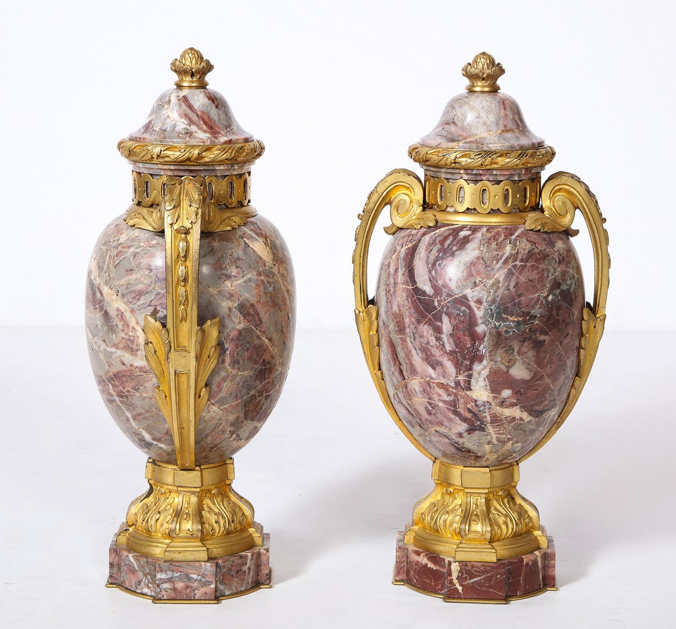 Pair of French Louis XVI style bronze mounted marble urns

The Rosso Levanto marble urns with well chased Louis XVI style bronze mounts.