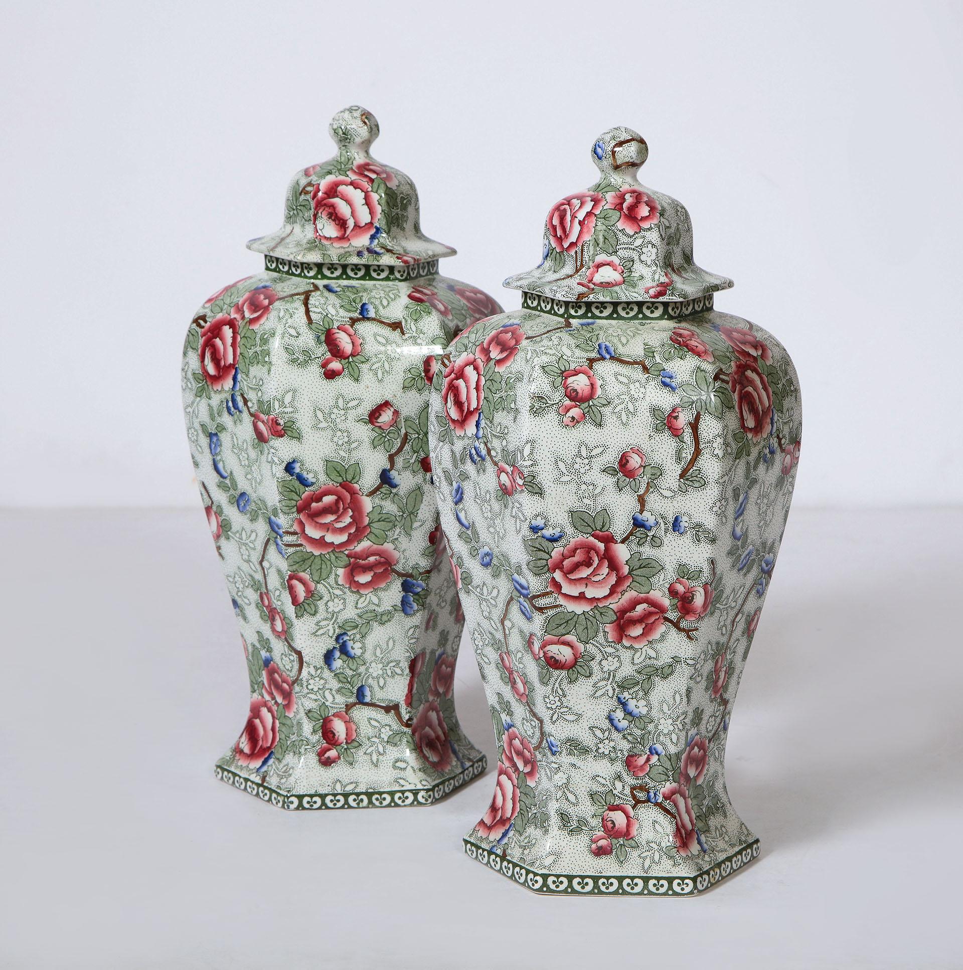 Pair of Covered Hexagonal Urns in a Chintz Pattern

The pair of covered urns all over decorated in a 
