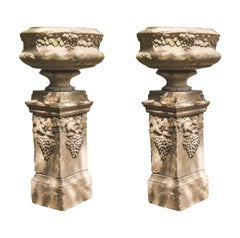 Pair of Stone Urns on Plinths, Decorative Grape Cluster Design, England, 1920s