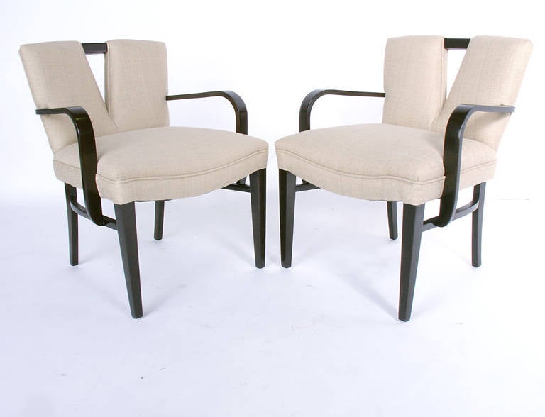 Pair of sculptural V back armchairs, designed by Paul Frankl for the Johnson Furniture Company, circa 1950s. The examples seen in the photos have been sold, but we have another pair available. They are currently being refinished and reupholstered,