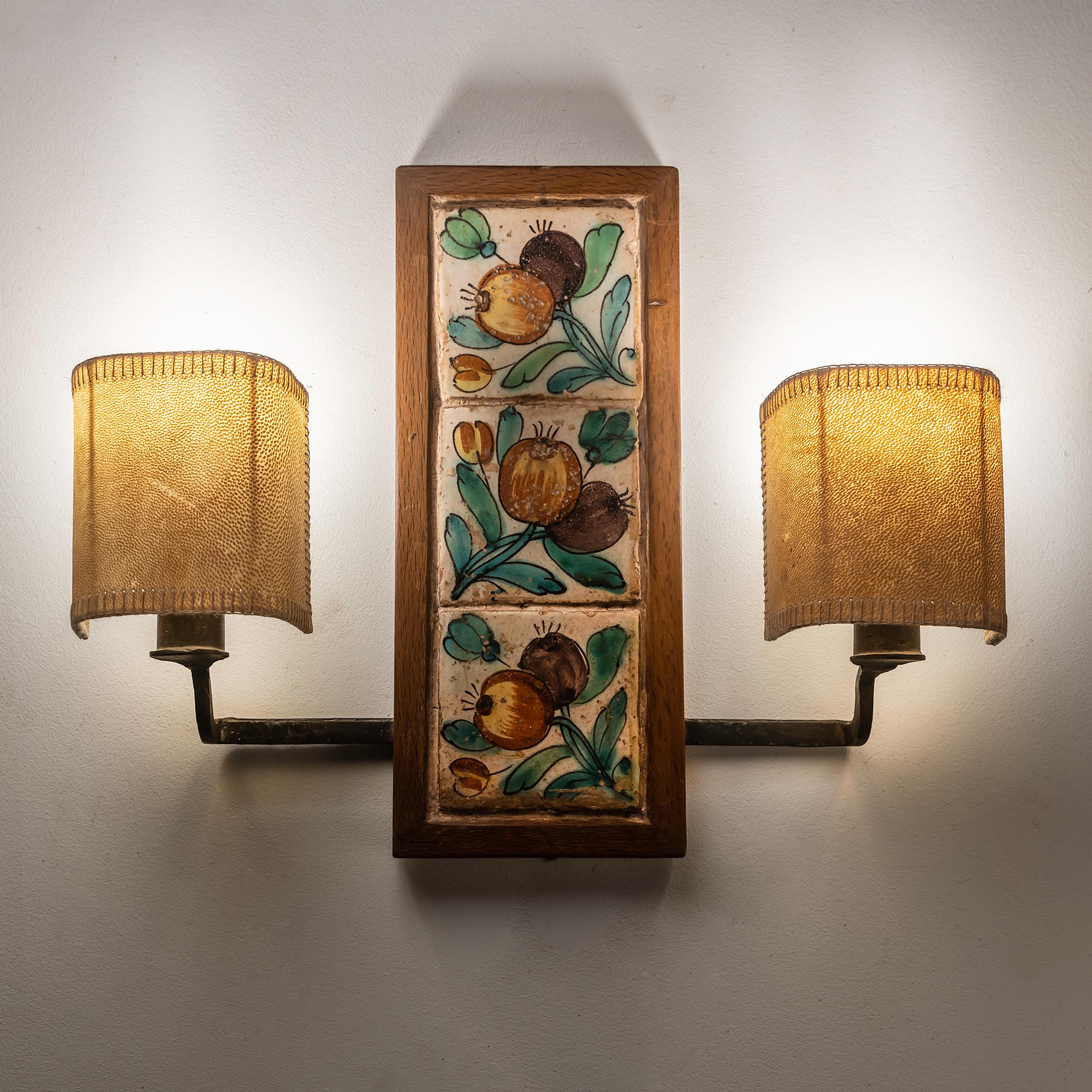 This pair of Valencian Tile Sconces exudes a distinct charm and allure, making them truly unique and special. Crafted in the heart of Valencia, Spain, these sconces showcase the rich cultural heritage and craftsmanship of the region, dating back