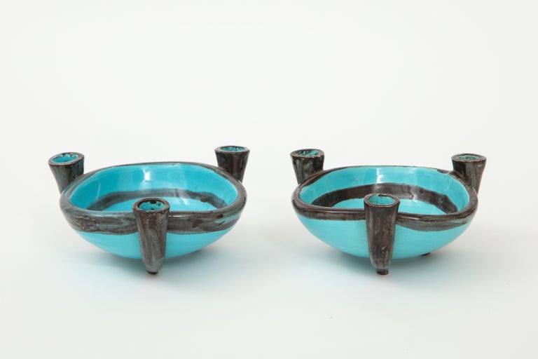 Pair of Ceramic Candelabra Cups, Vallauris, France, 1955. 

These stunning freeform ceramics display dark concentric circles cast against a beautiful aqua blue base. The pair was originally made for the Palais de la Méditerranée in Nice and are