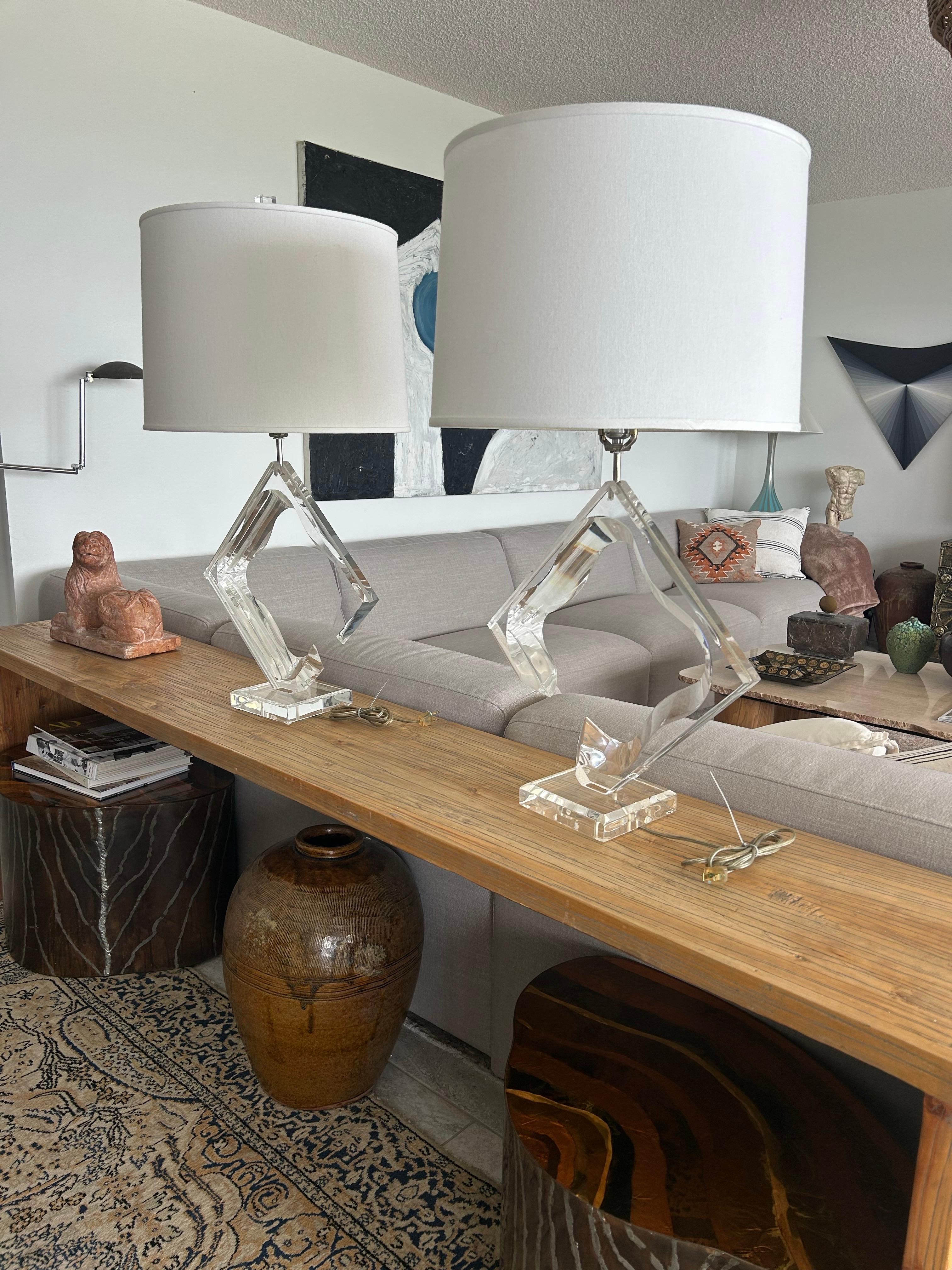 A pair of signed Van Teal lucite lamps. They are  in  very good condition. The lucite it's very clean, smooth and shiney.Both are in  original working condition and includes two custom shades 16 inches in diameter and 12 inches deep… Architectural