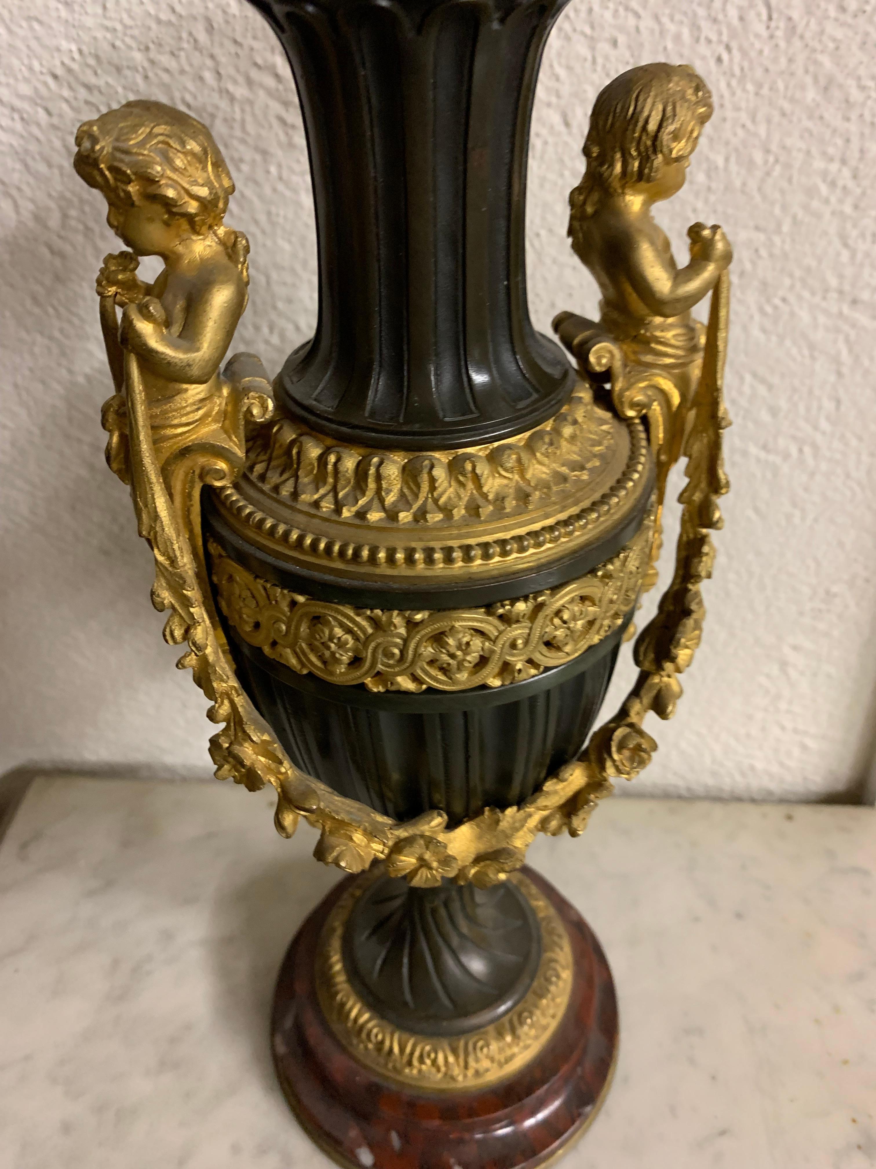 A very fine pair of vase with cherub on the side. The base is griotte marble Its bear the mark of Millet a paris on the base of the vase.
 