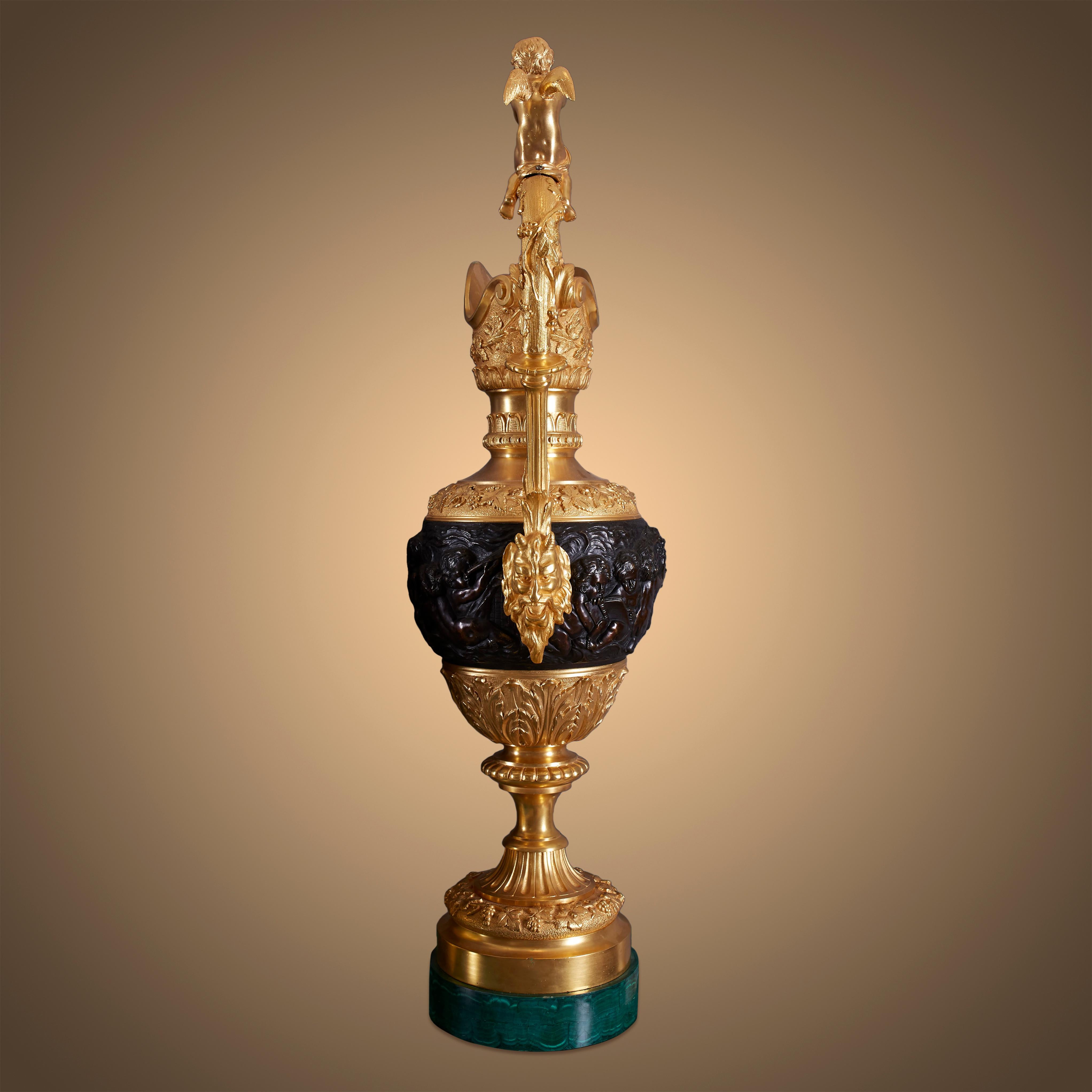 These decorative water vases are a complemetary pices to the ormolu. The water vases are decorated with angels who are surrounding the competition that takes place on the mantel clock. The two vases are designed with delicate curves, adorned with