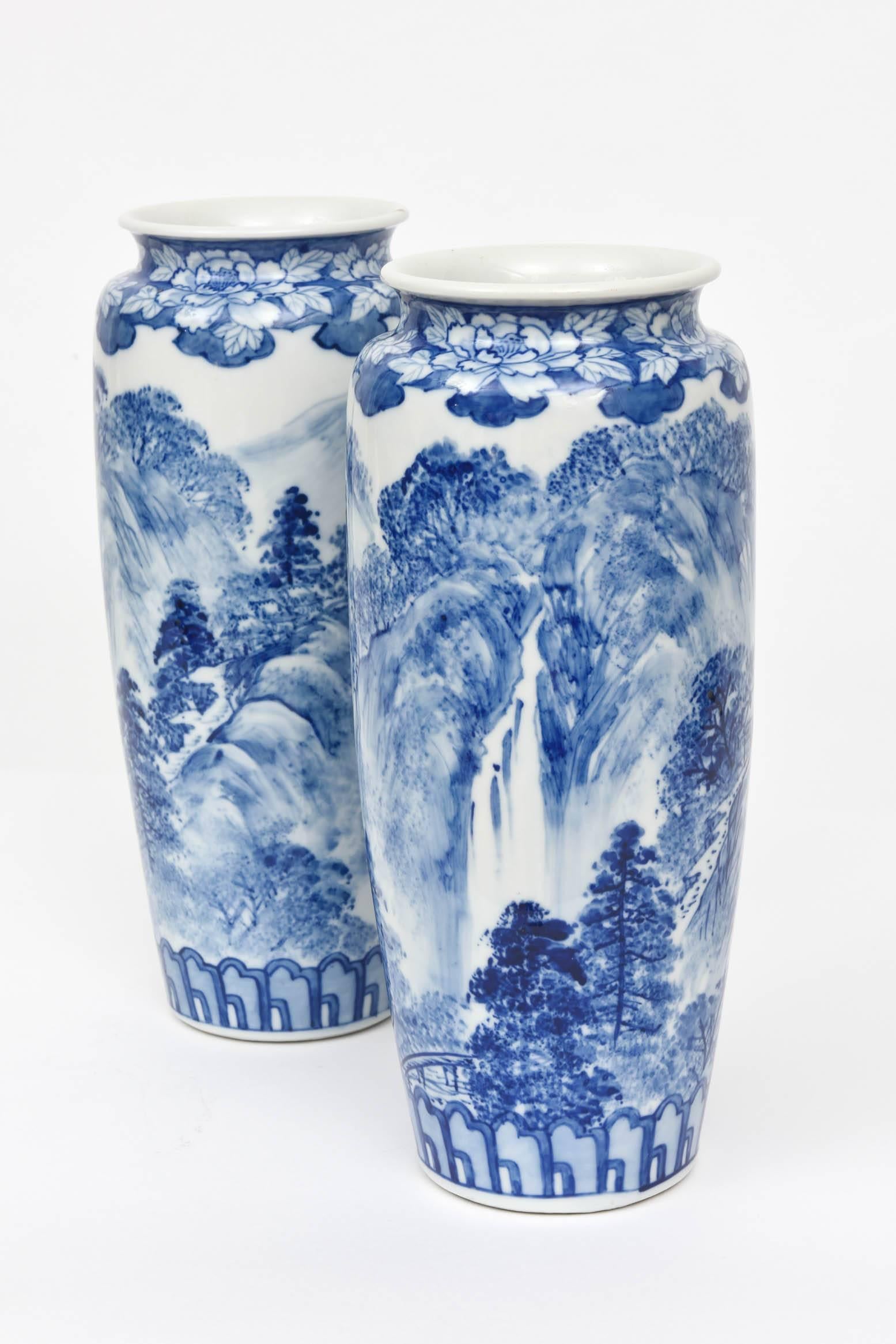 A classic blue and white porcelain pair of vases. Full scenic surround and signed on the bottom corners with full hall marks. Very pleasing tapered shape and nice height. So hard to find these in pairs. Wonderful antique condition.