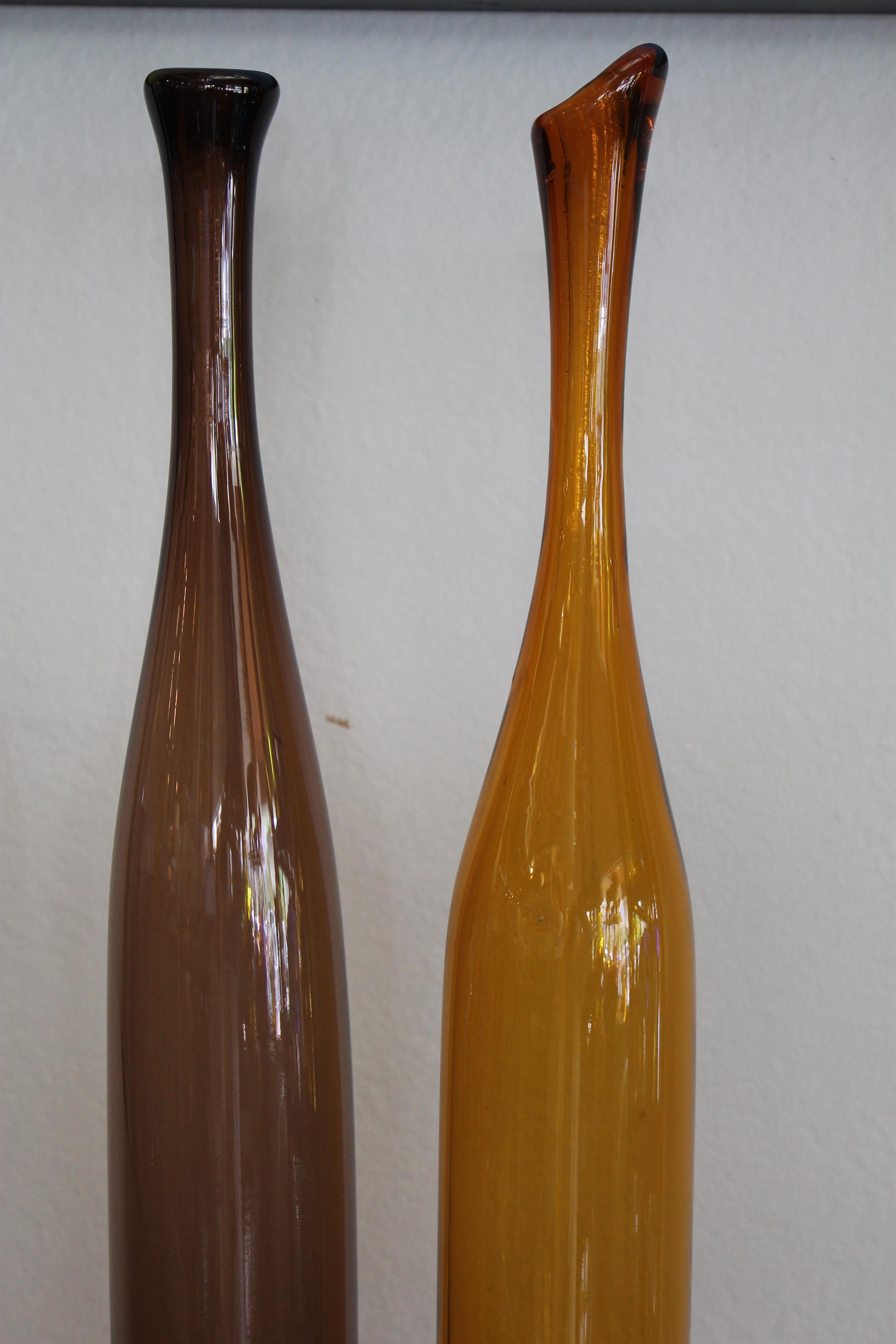 Pair of Joel Myers colored glass vases, model no. 6427, 1960s. Manufactured by Blenko. The tallest vase is 23.25