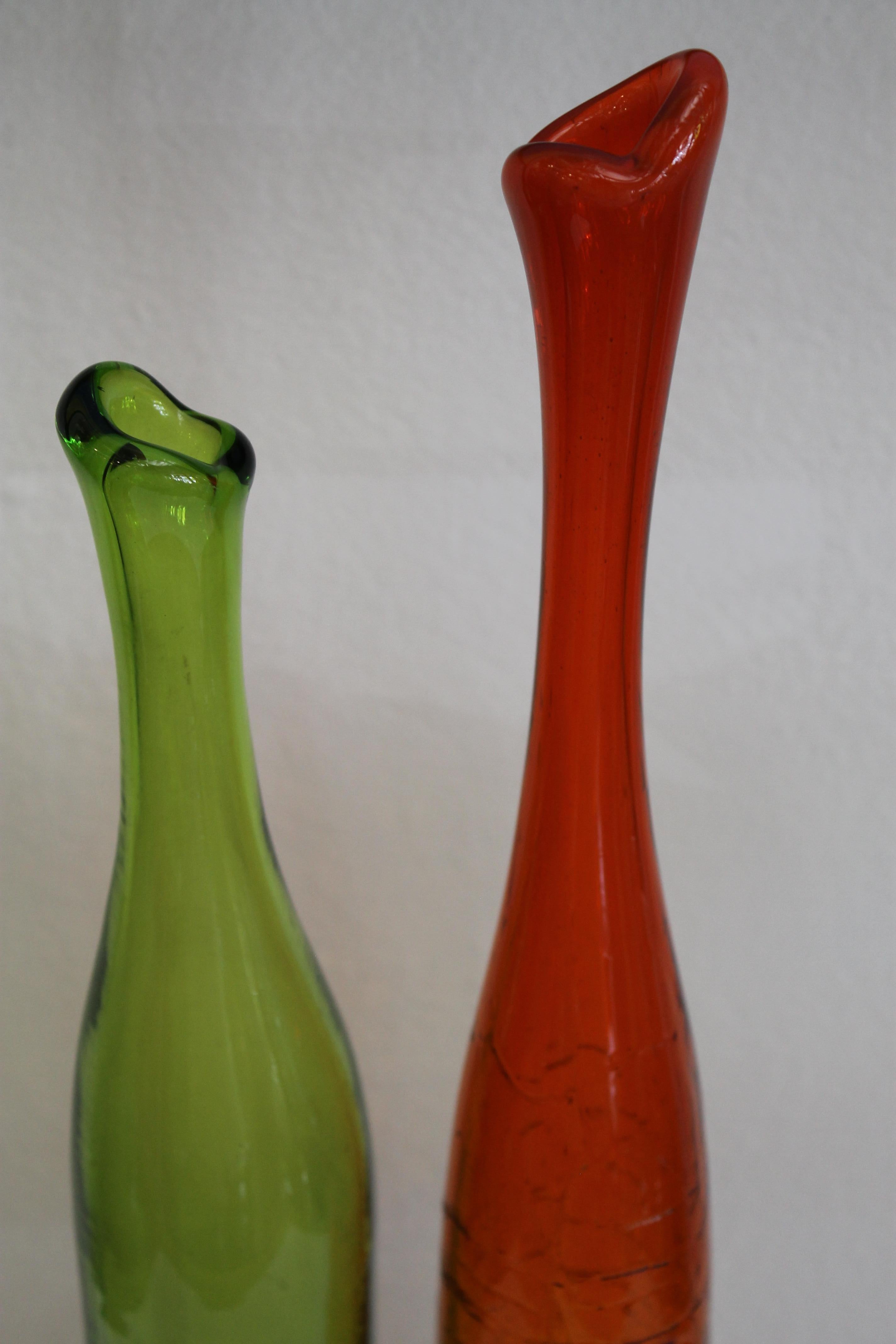 Pair of Joel Myers colored glass vases, model no. 6427, 1960s. Manufactured by Blenko. The tallest vase is 24.25