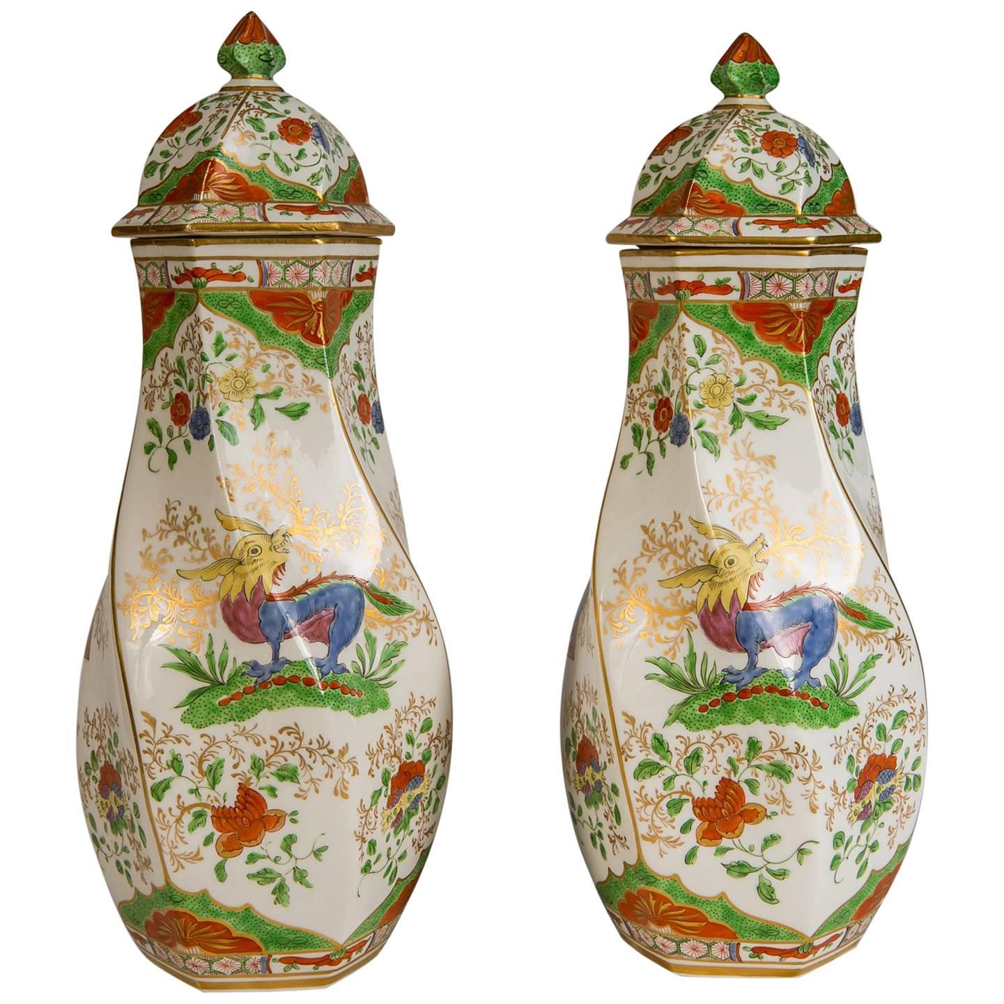 This is a rare pair of vases decorated with a very popular pattern known as Dragon in Compartments, also known as, Kylin in Compartments. It is an exotic pattern originally made on 18th century Chinese export porcelains. Each vase is hand painted