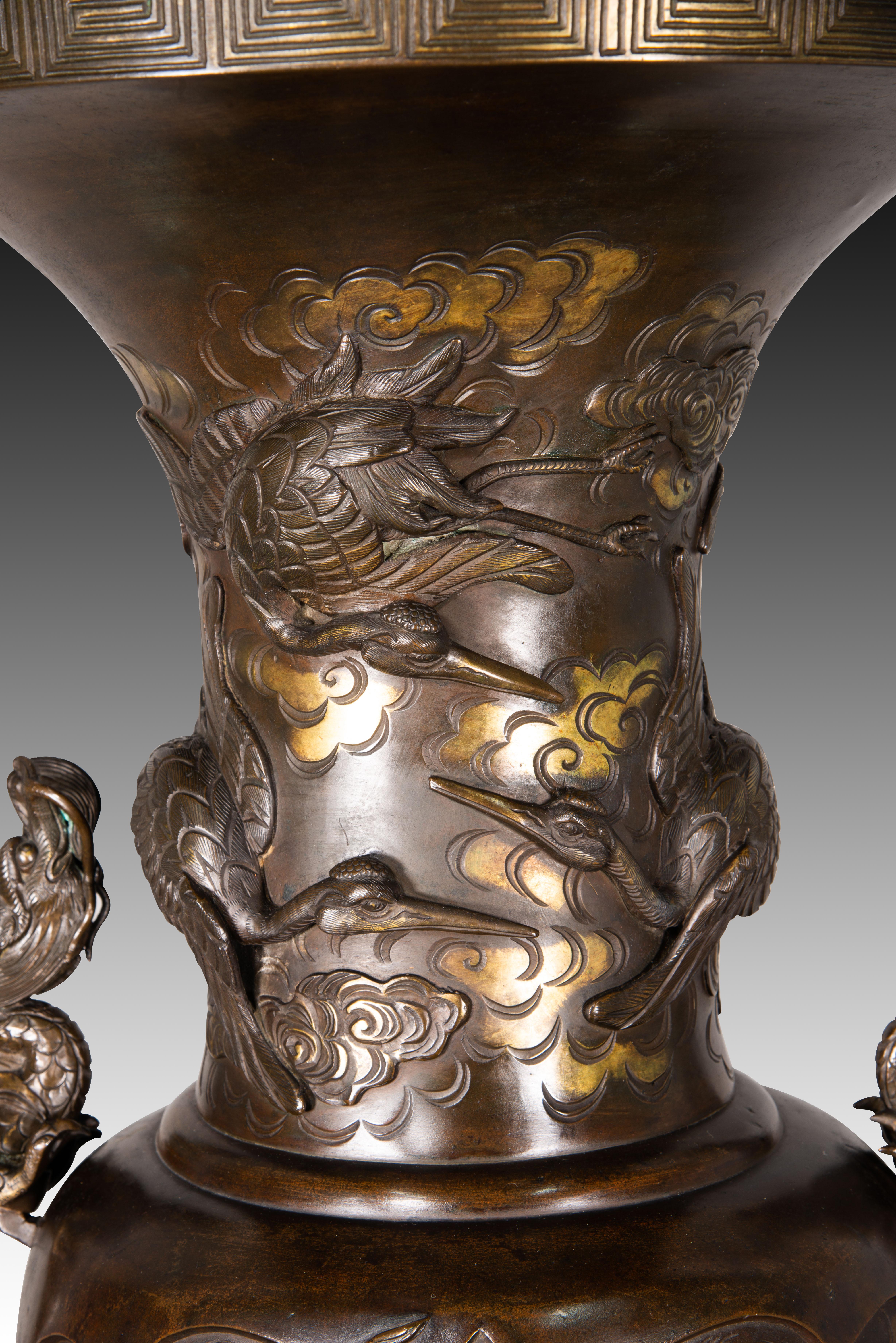 Pair of vases with bases with elephant heads. Bronze, wood, etc. 19th c. etc. 12