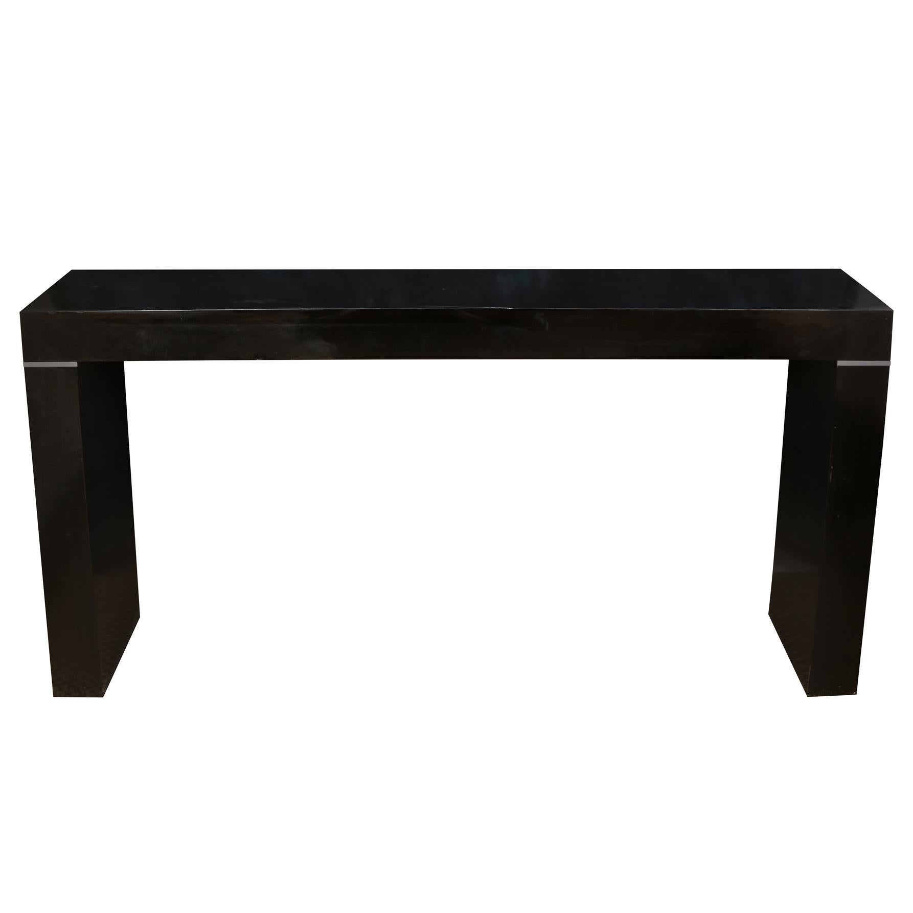 A pair of modern design, sleek Vaughan Benz console tables in black gloss, with silver trim.