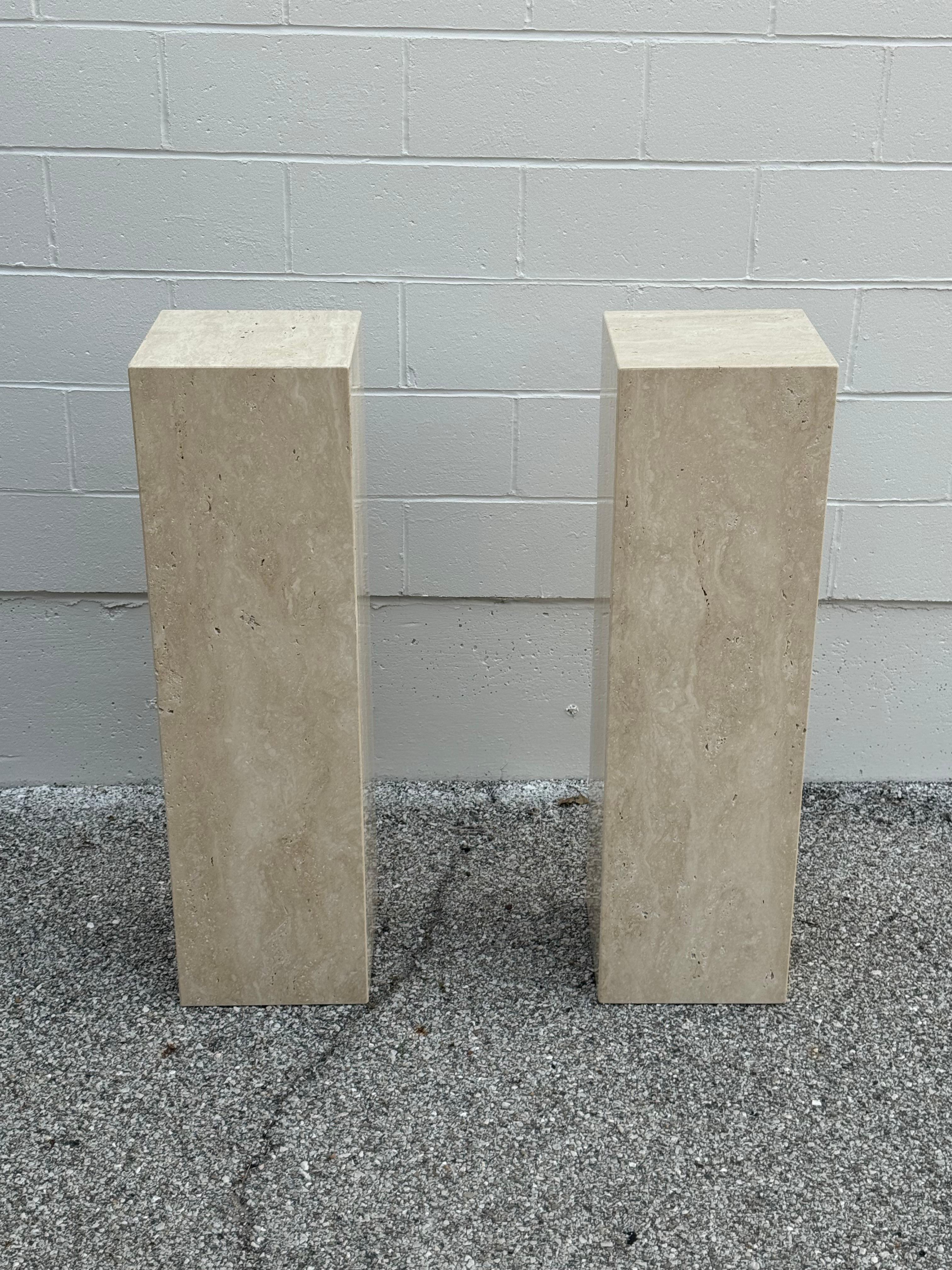 Wonderful 1980s Post modern Italian pair of matching Travertine art pedestals, stands or columns. Made of Italian beige vein cut travertine. In very nice condition. 

