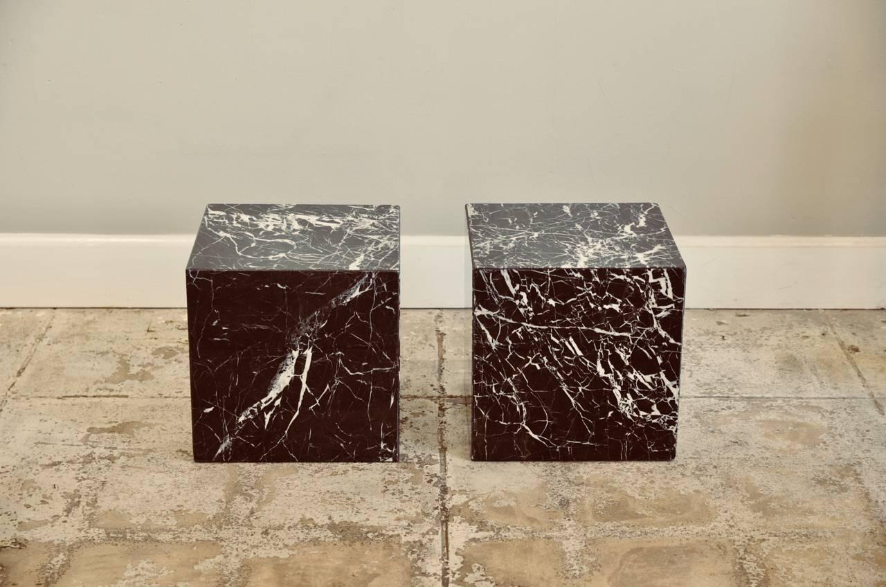 Pair of veined marble block side tables or coffee table. Cool, minimalist design. Thick pads under the bases to protect the edges.