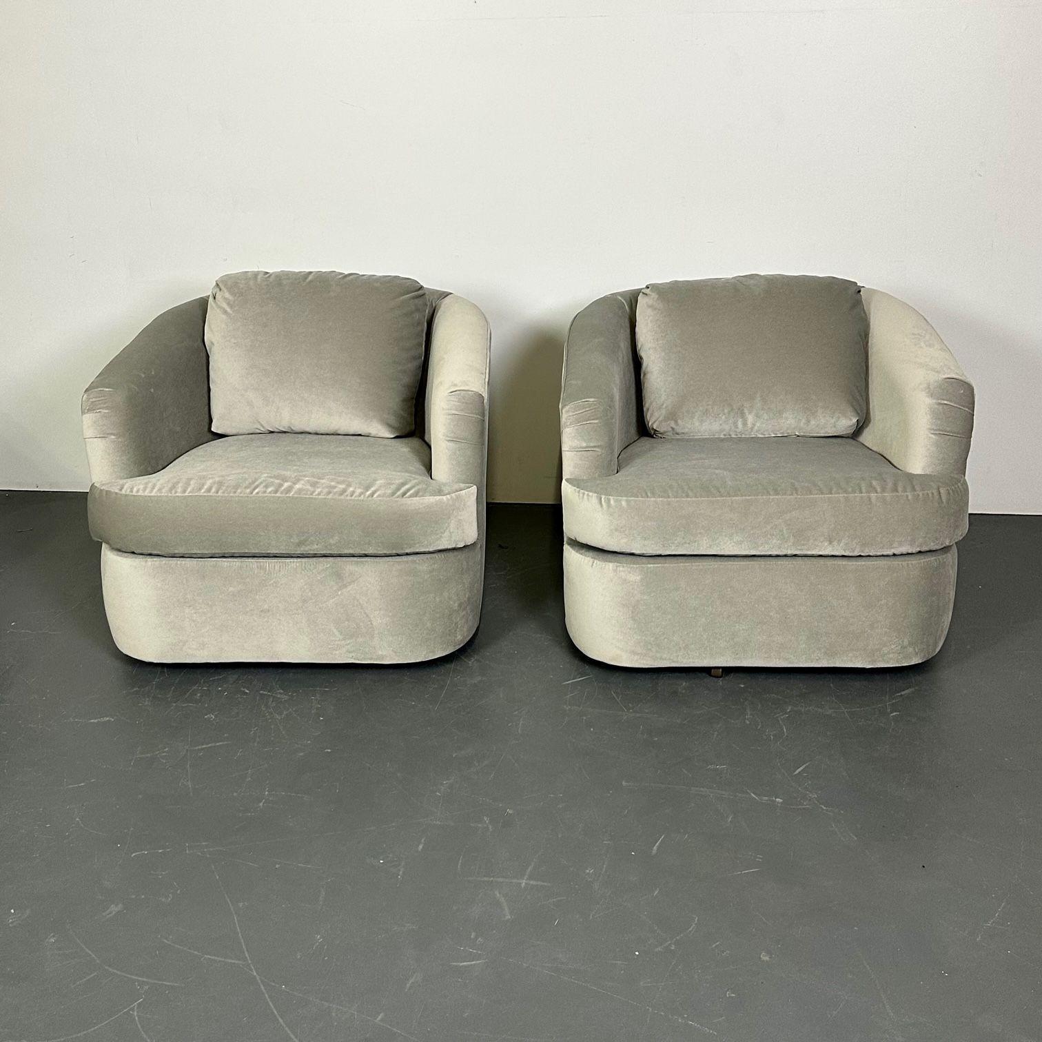 Pair of Velvet Mid-Century Modern Milo Baughman style swivel / lounge chairs
 
Each having a thick comfortable cushion recently recovered having a barrel back form and shape on swivel bases in a new grayish velour upholstery in the manner of Milo
