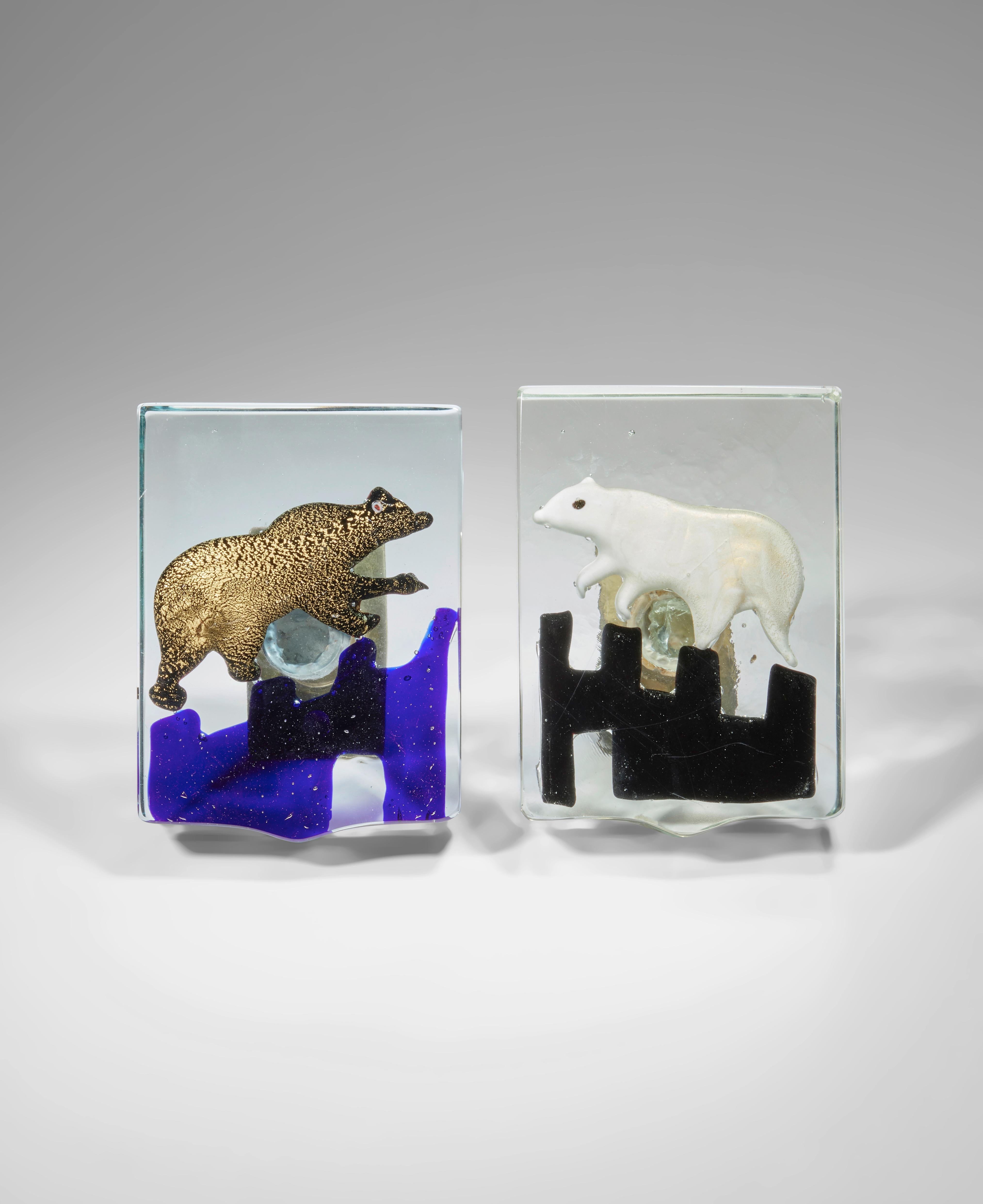 Venetian blown glass push and pull door handles from a hotel in Venice late 1940's, by Alfredo Barbini (1912-2007) for Vitreria Gino Cenedese, Italy.
Polar bears climbing on geometric glaciers set in clear and opaque glass block set with brass