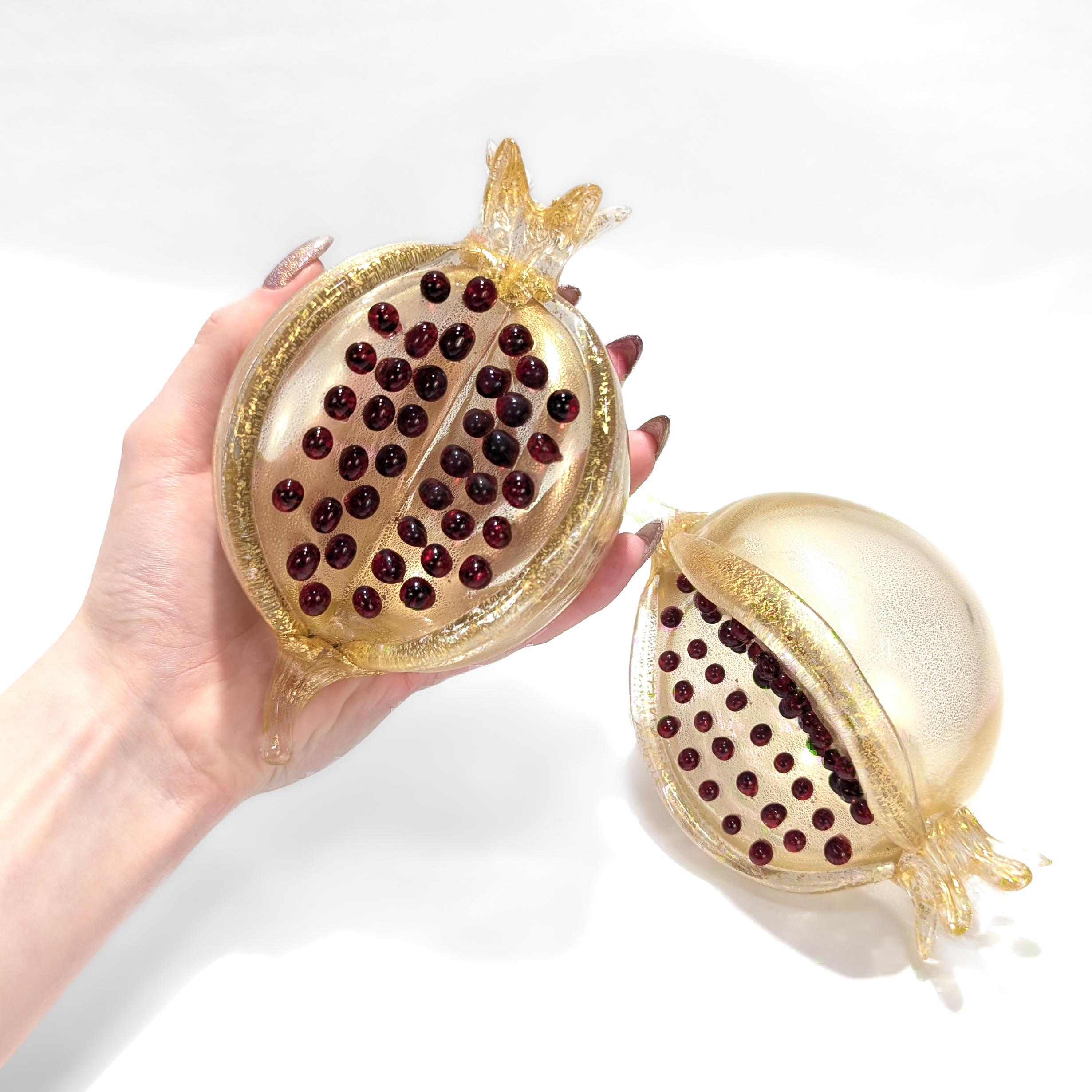 A fine pair of Murano glass fruit figures.

Designed by Romeo Gigli for Pauly & Co.

In the form of a pomegranate.

The body, stem end, and crown with gold inclusions and the seeds comprised of red, applied glass knops.

Simply wonderful, high-level