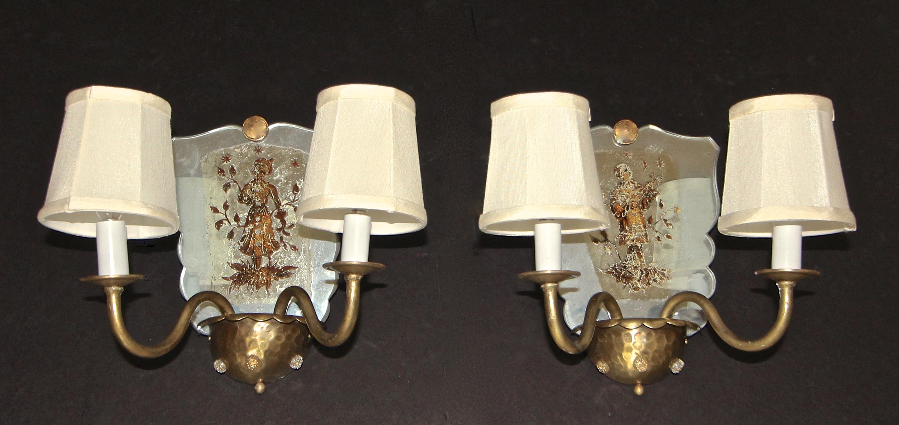 Pair of Venetian mirrored gold metal 2-arm wall sconces with applied classical figures decoration to mirrored backs. Each uses two candelabra size bulbs, newly wired. Shades included.