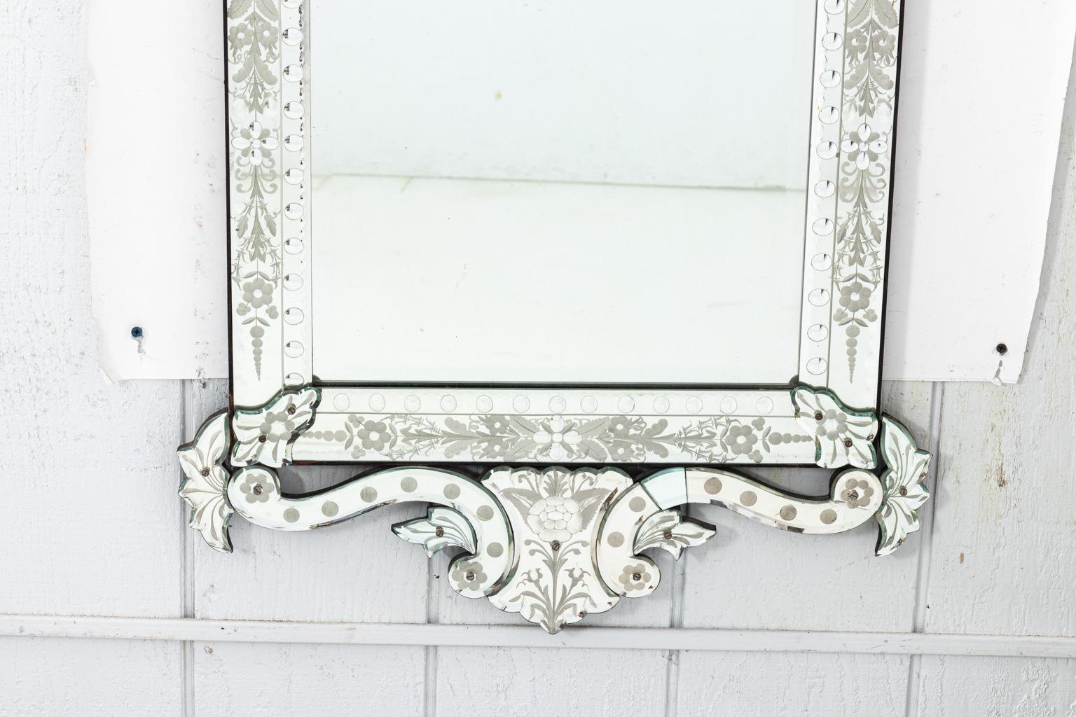Pair of Venetian mirrors detailed with floral motifs. Please note of wear consistent with age.