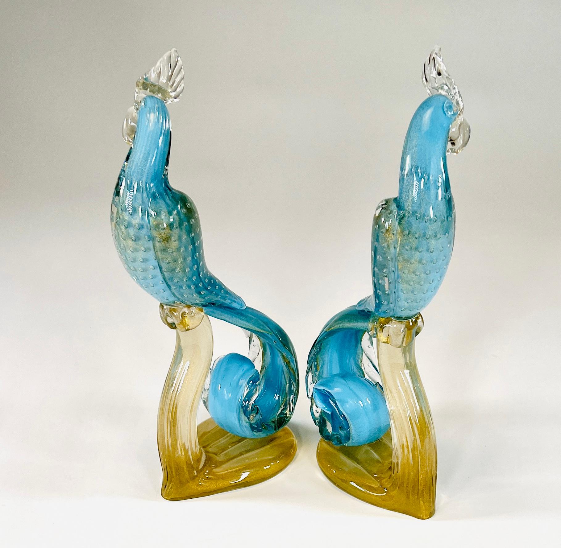 This is a matched pair of hand blown, tall and fanciful Murano 