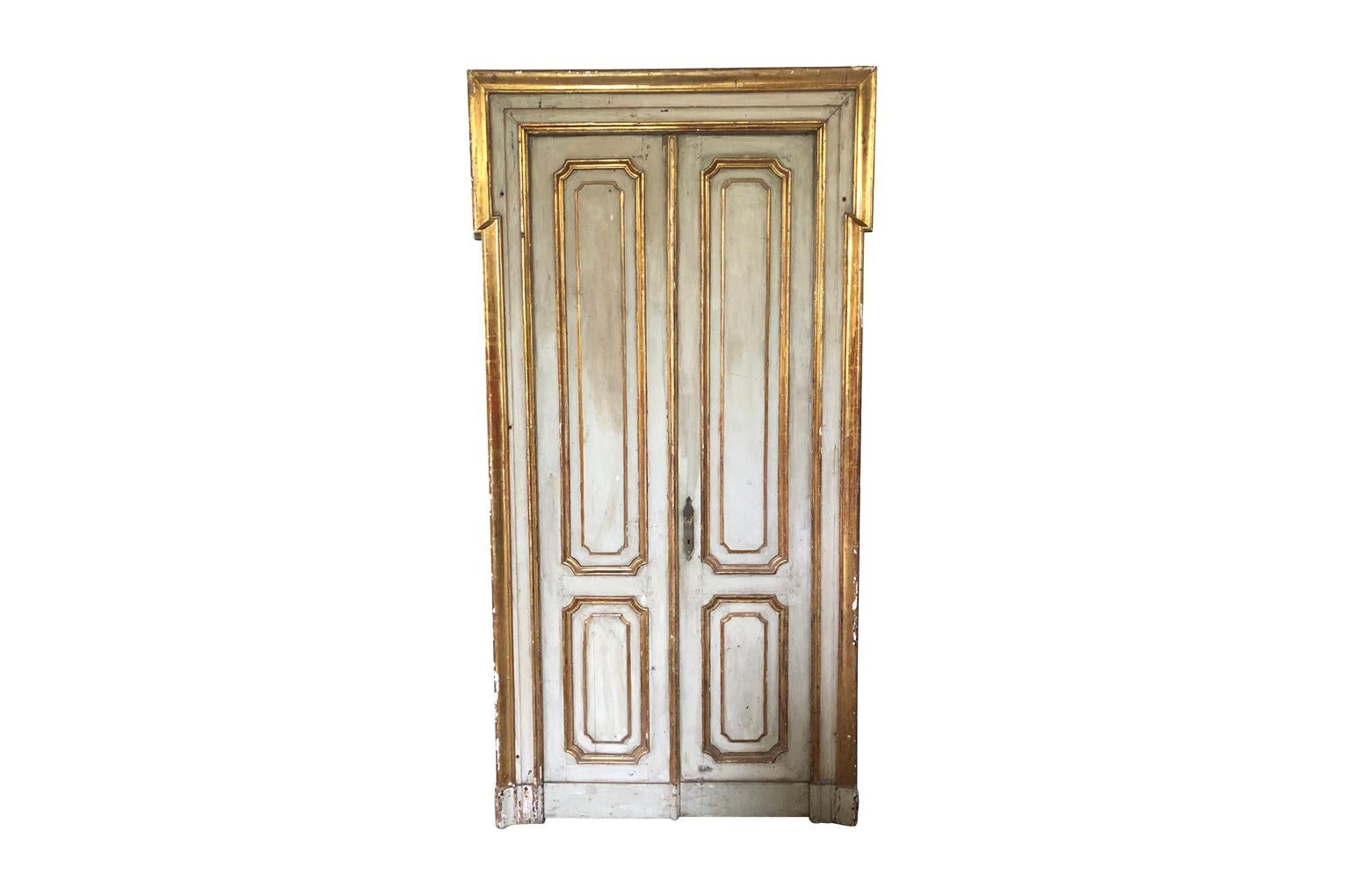 A fantastic pair of mid-19th century Venetian Palazzo Doors in painted and gilt wood. True statement pieces for a sumptuous interior.