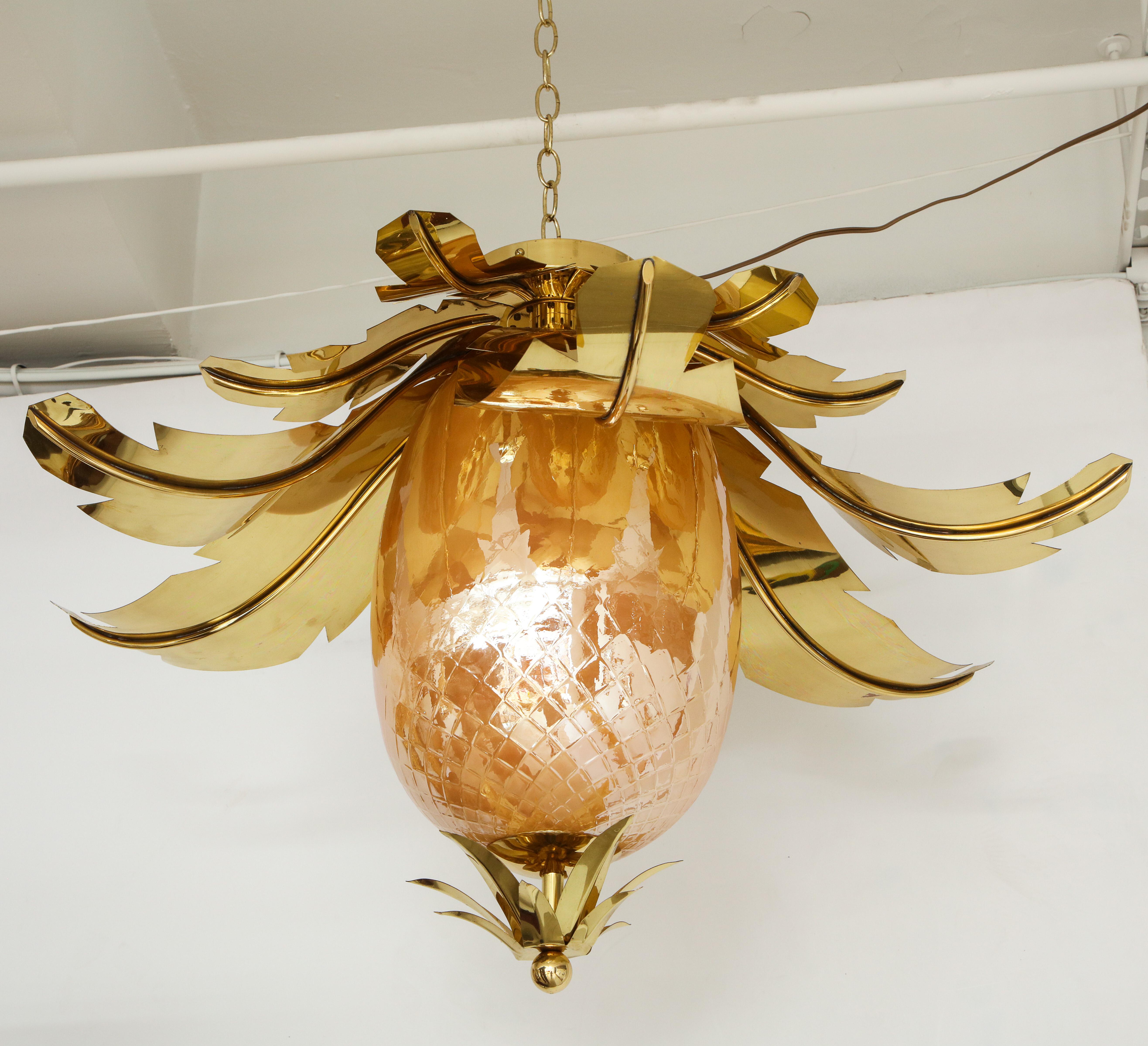 Pair of Venetian peach glass and brass leaves pendant chandeliers attributed to Veronese.